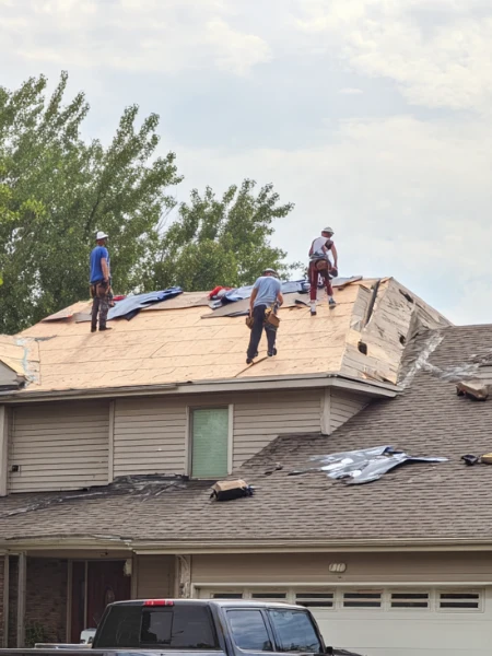 Roofers working on roof