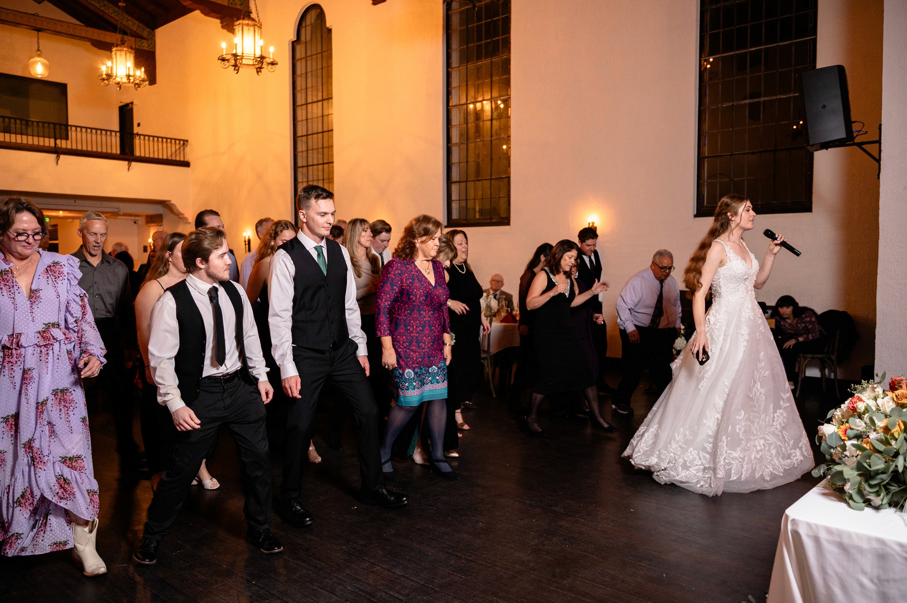 Flat lay wedding details with bouquet, rings, and sparkling bridal heels