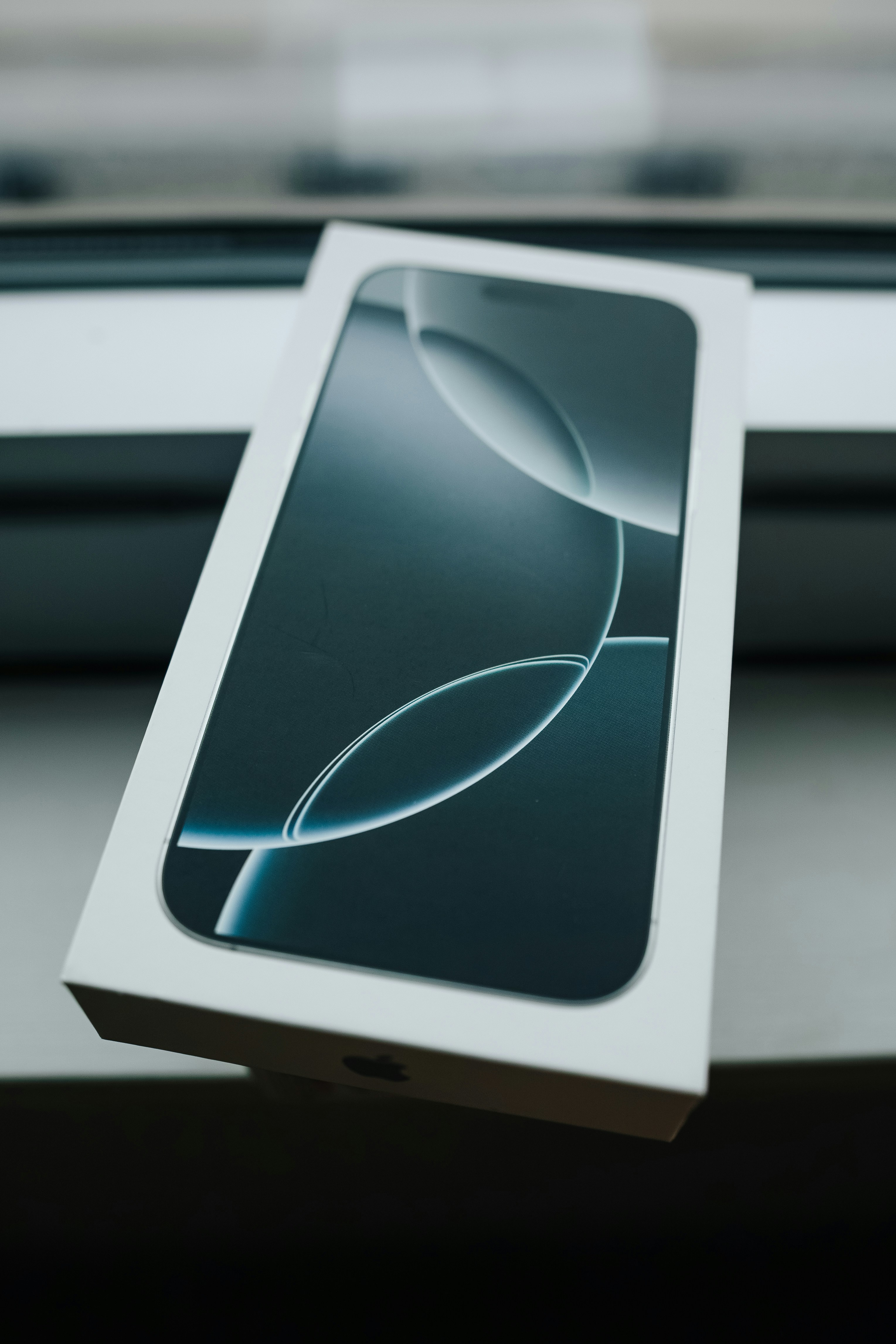 A box sitting on top of a window sill