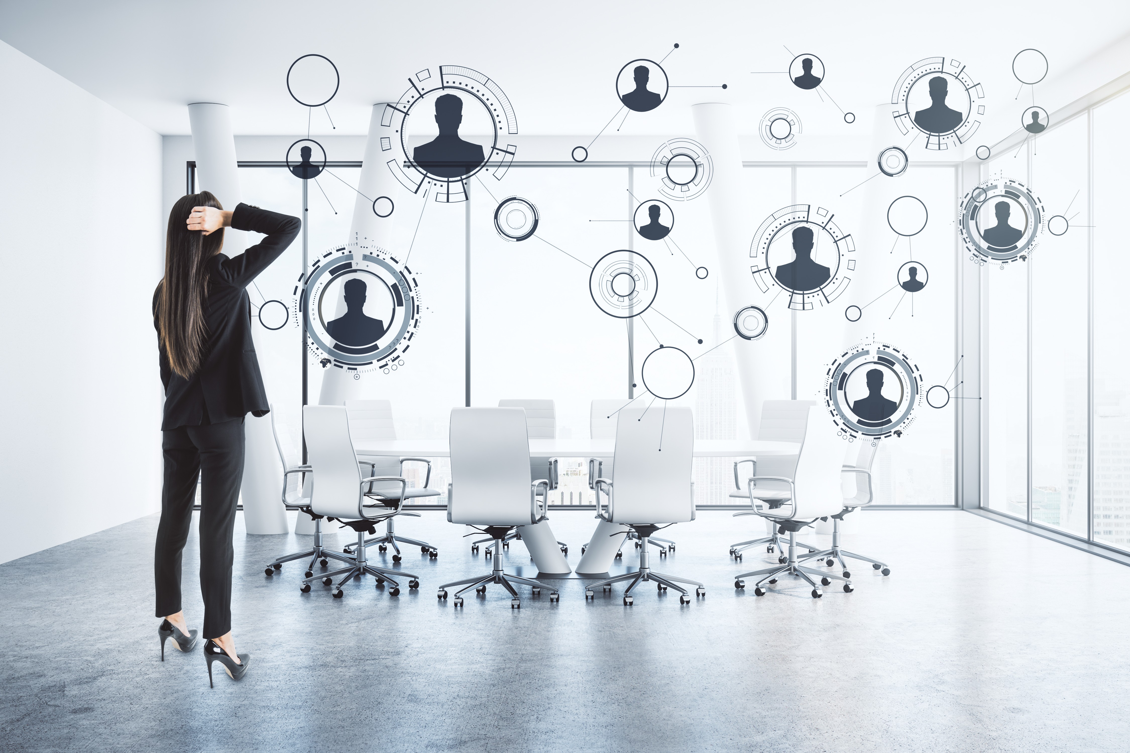 Service business owner standing in an empty conference room looking at a digital network of disconnected contacts — representing the challenge of reaching new clients beyond your existing referral network.
