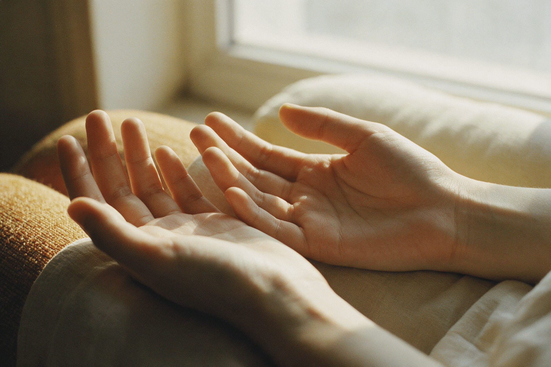 Hands resting open and relaxed