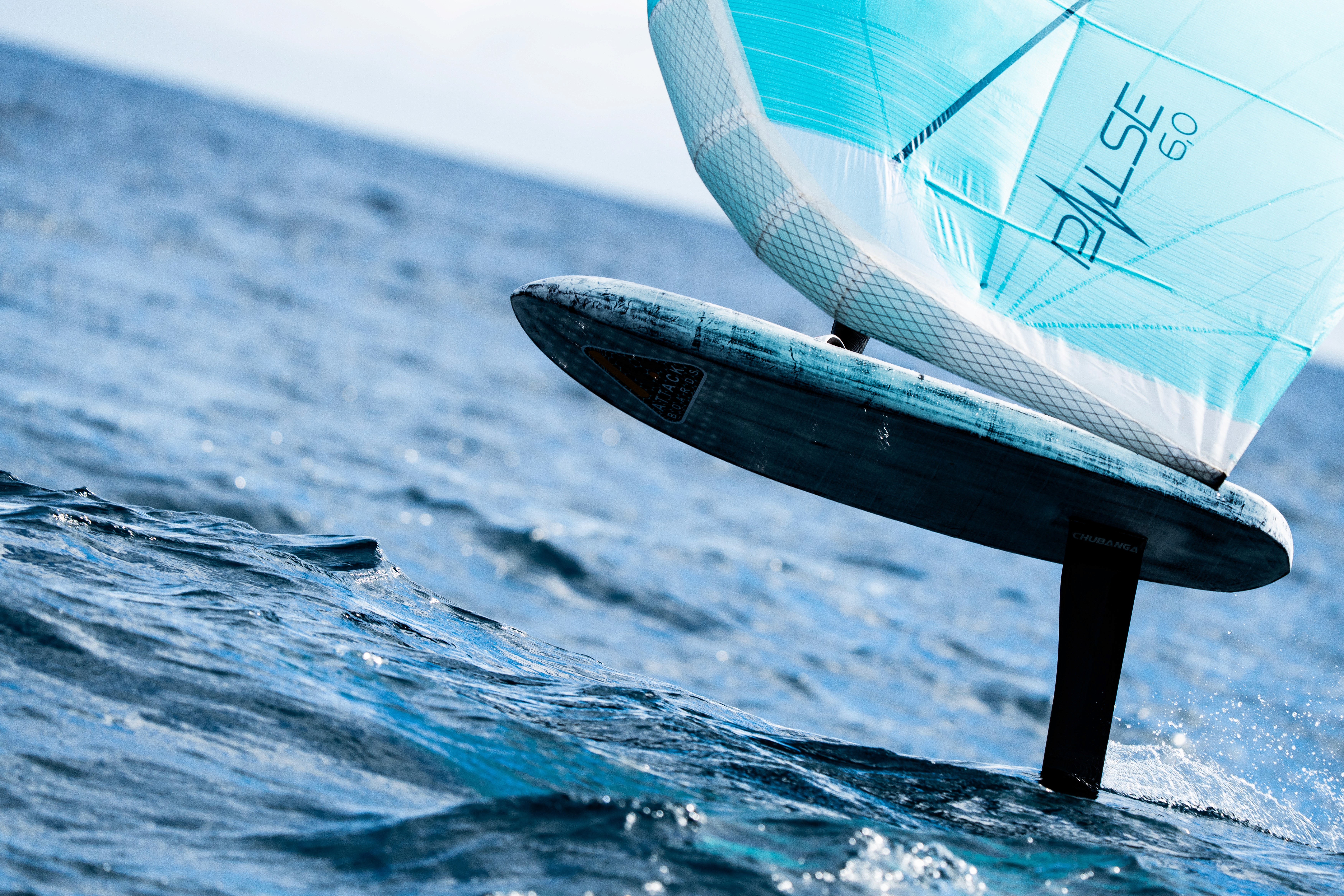  A woman with her eyes closed, wearing a helmet, appears to be in a moment of concentration or relaxation.