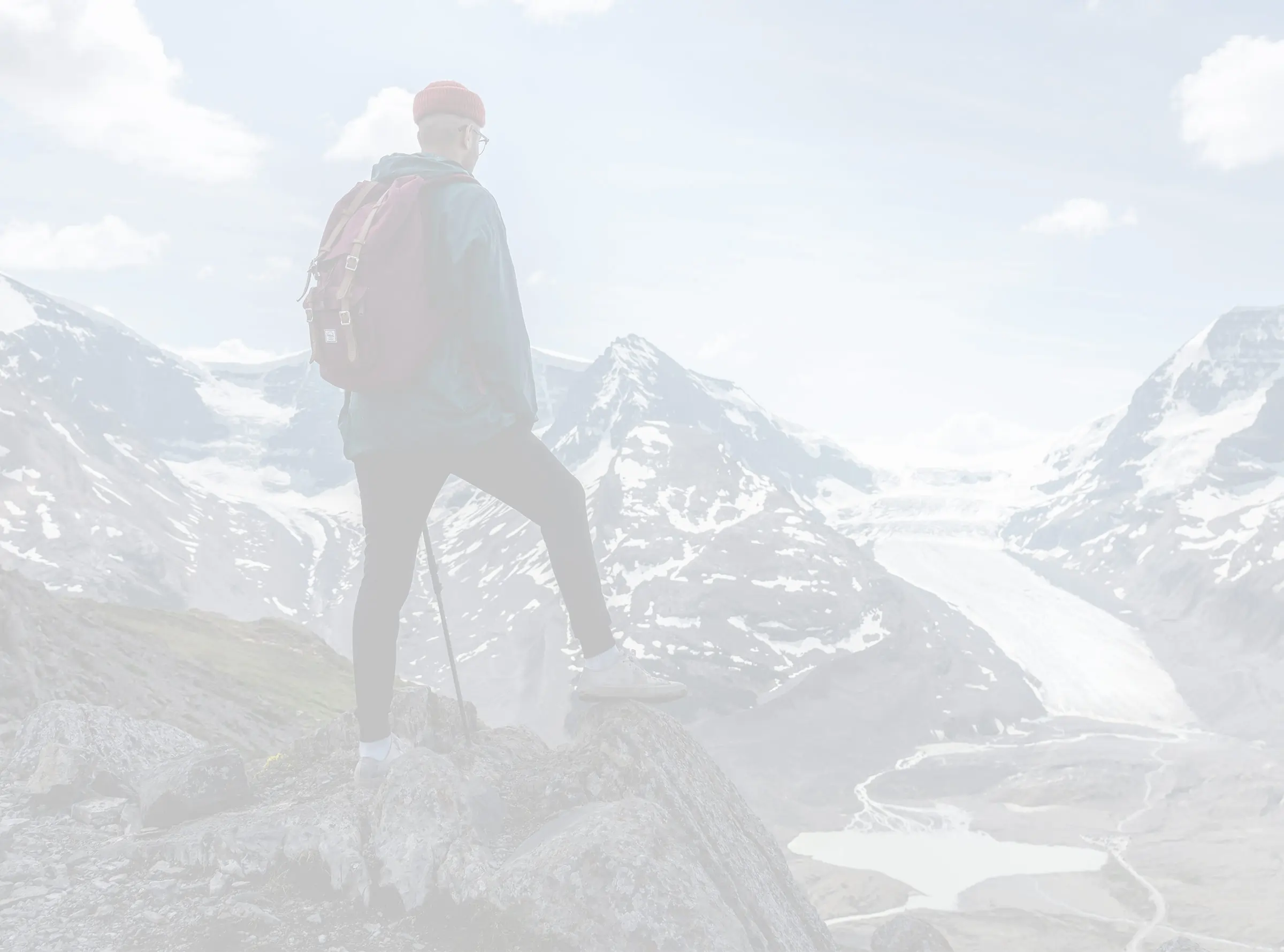 Man at the top of a snow-covered mountain in Denever, Colorado. 