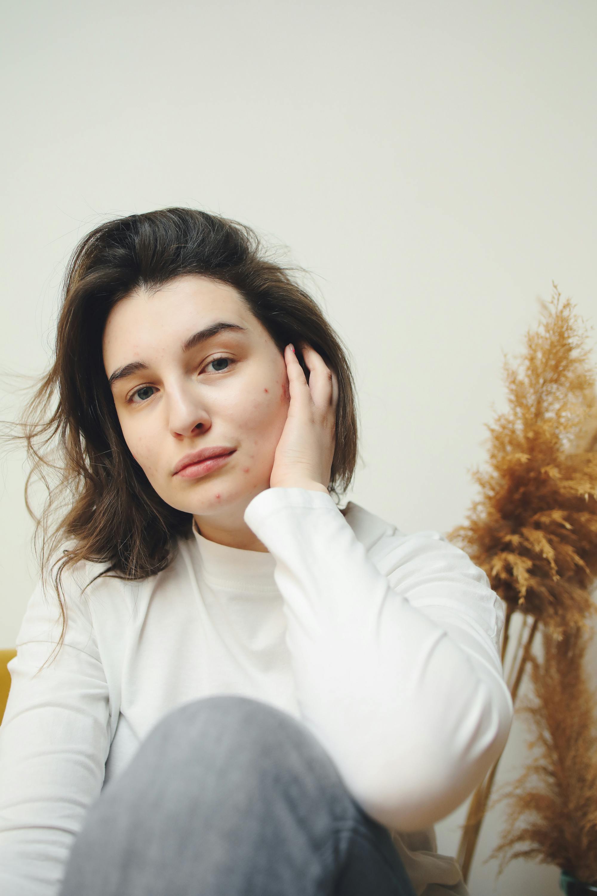 Man applying skincare product to his face