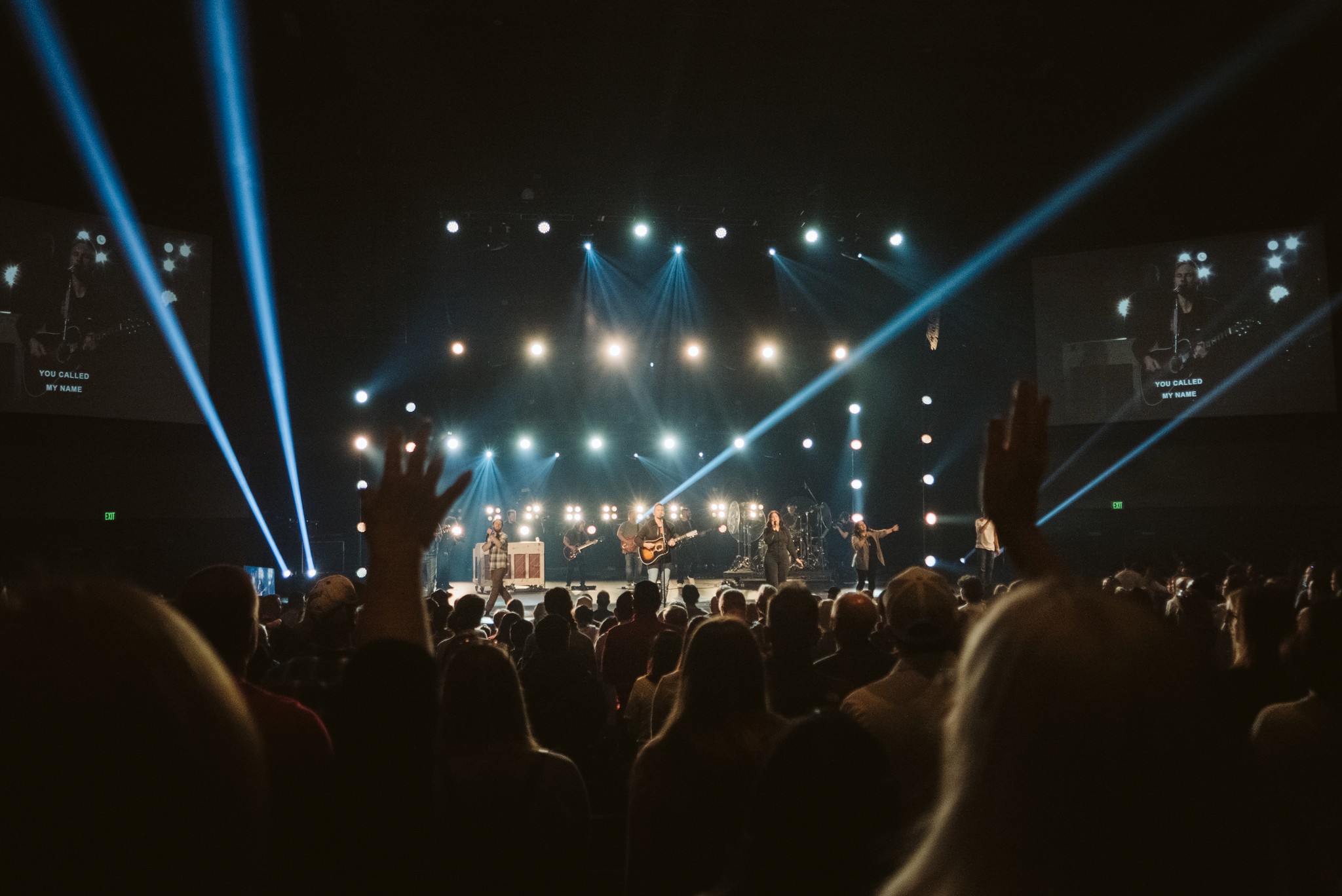 two people looking at a tablet and smiling