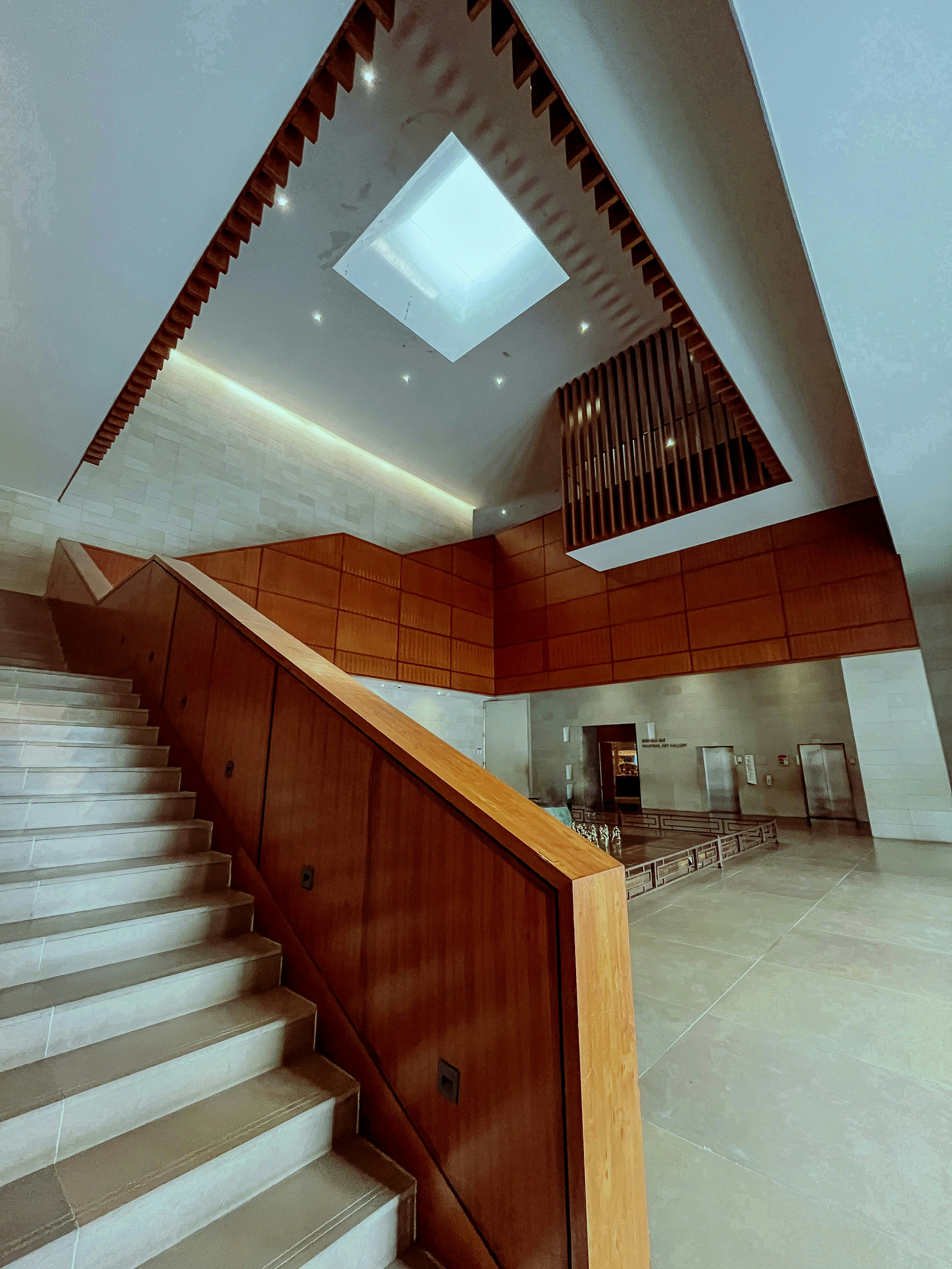 A staircase with a skylight above it