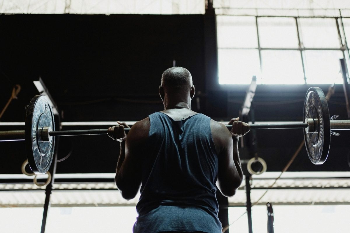 A man lifts a barbell.