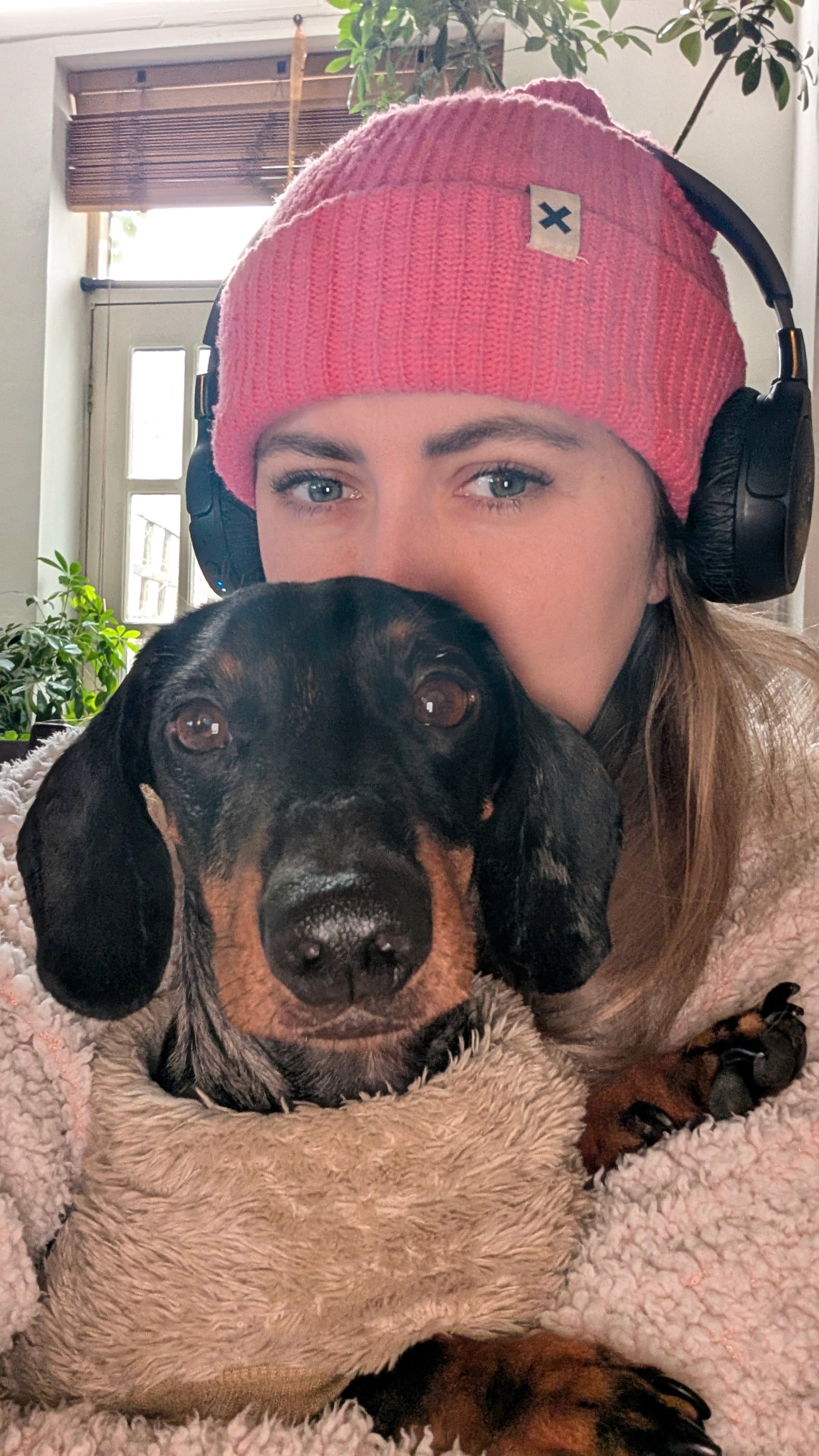 headshot of female and sausage dog