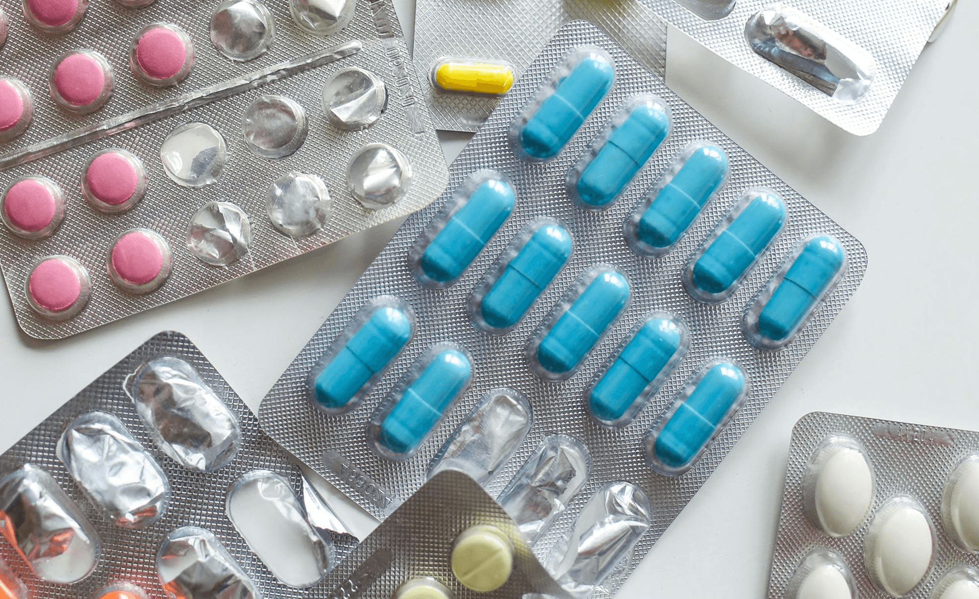 Assorted prescription pills and capsules in blister packaging