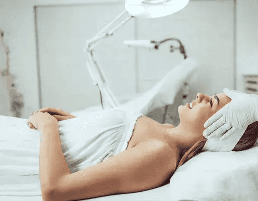 Woman undergoing VISIA Skin Analysis with advanced imaging device that captures high-resolution facial scans to evaluate skin texture, pigmentation, and underlying concerns.