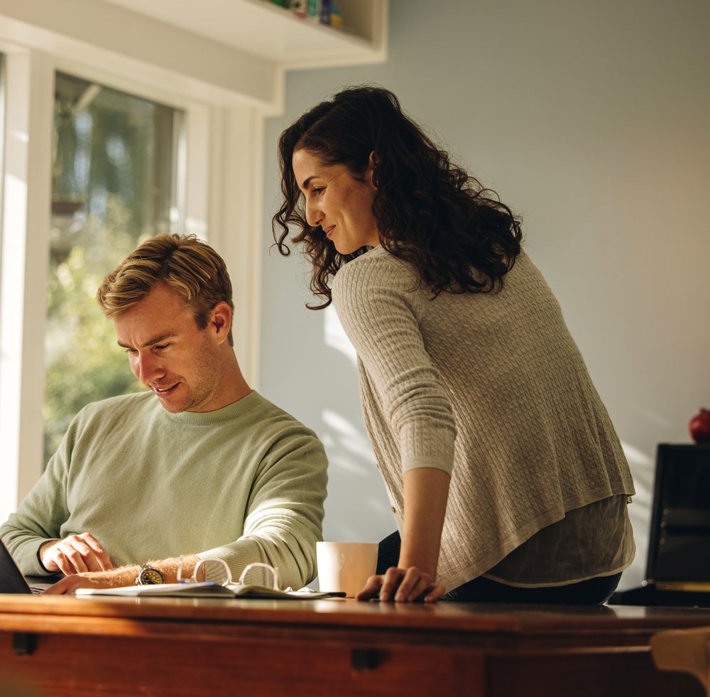 A couple reviewing their sale together