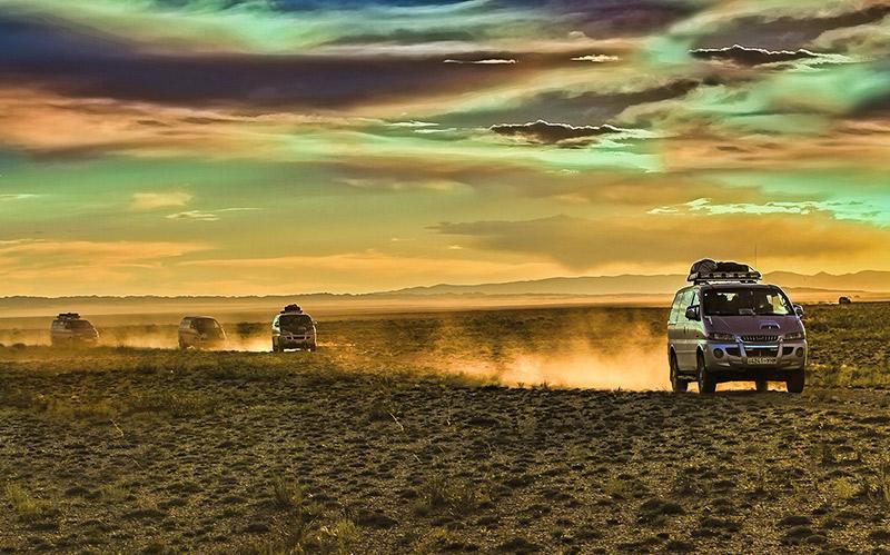aerial view of village on mountain cliff during orange sunset