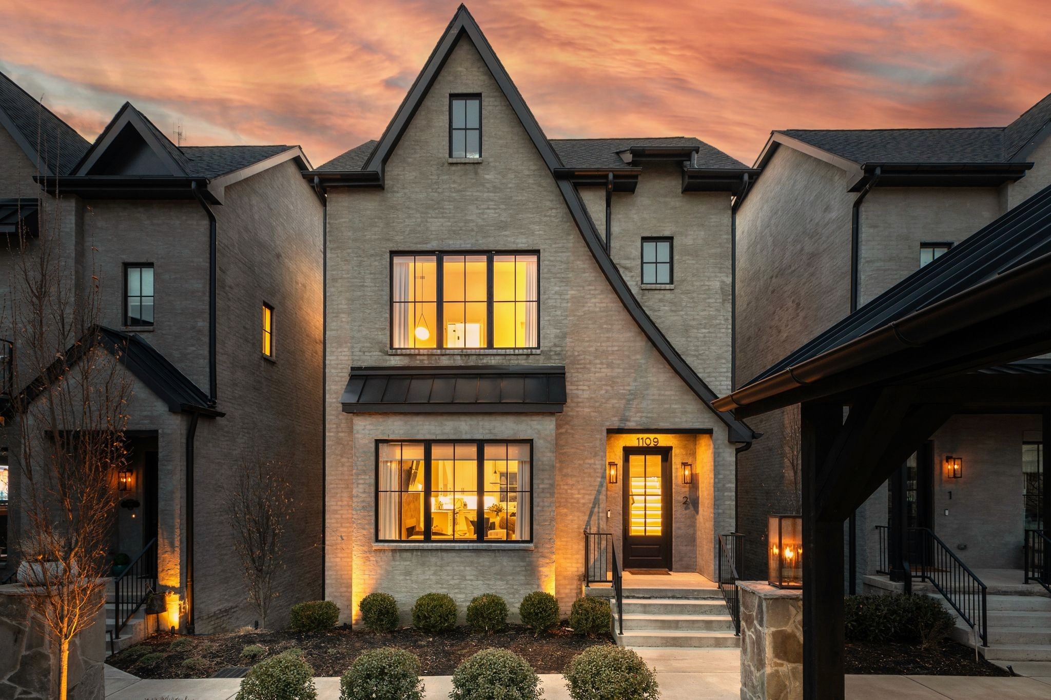 Luxury single-family home in Nashville, TN with modern design, high-end finishes, landscaped yard, and professional property management services
