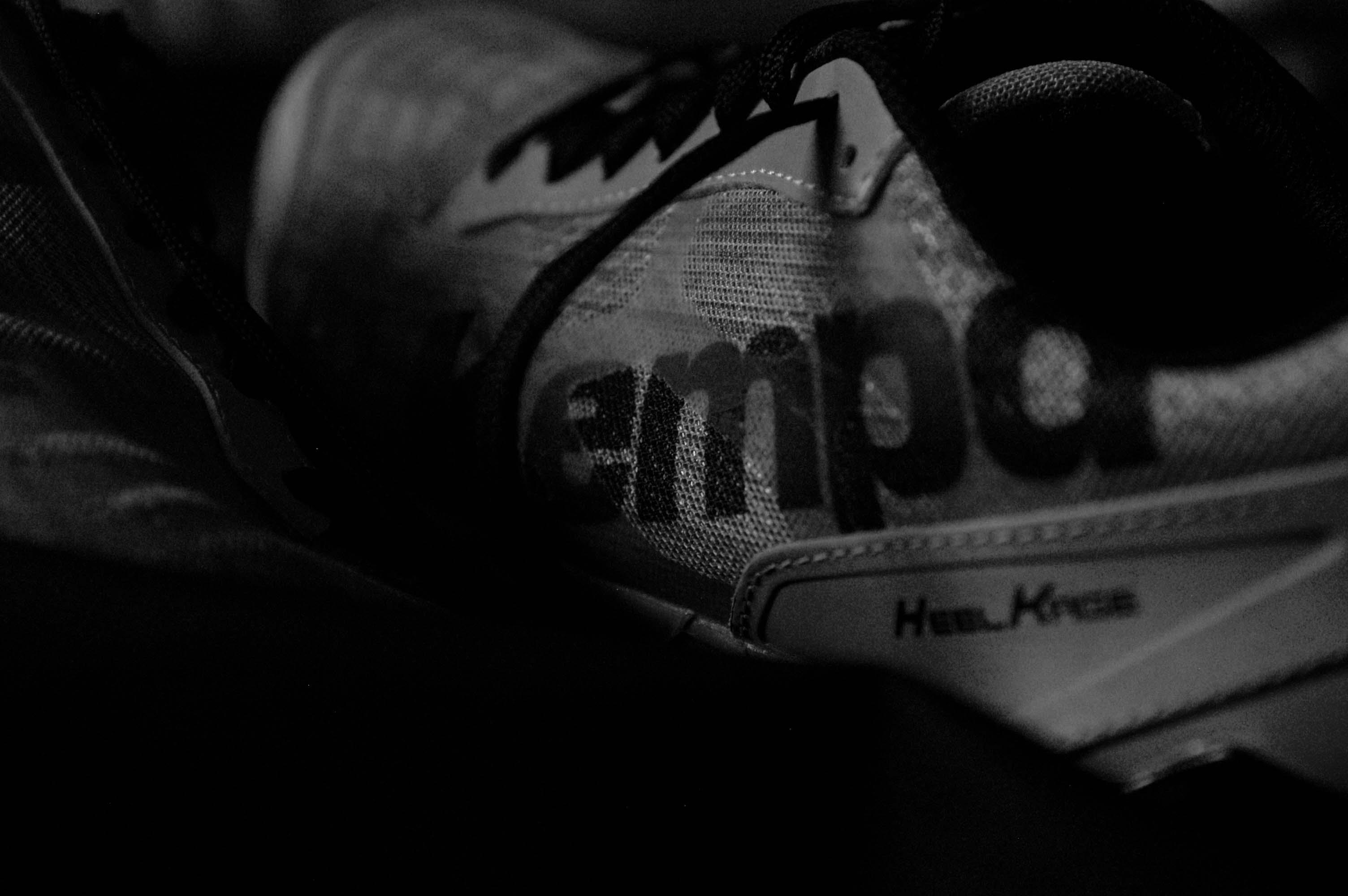 Black and white closeup photo of trainer shoes