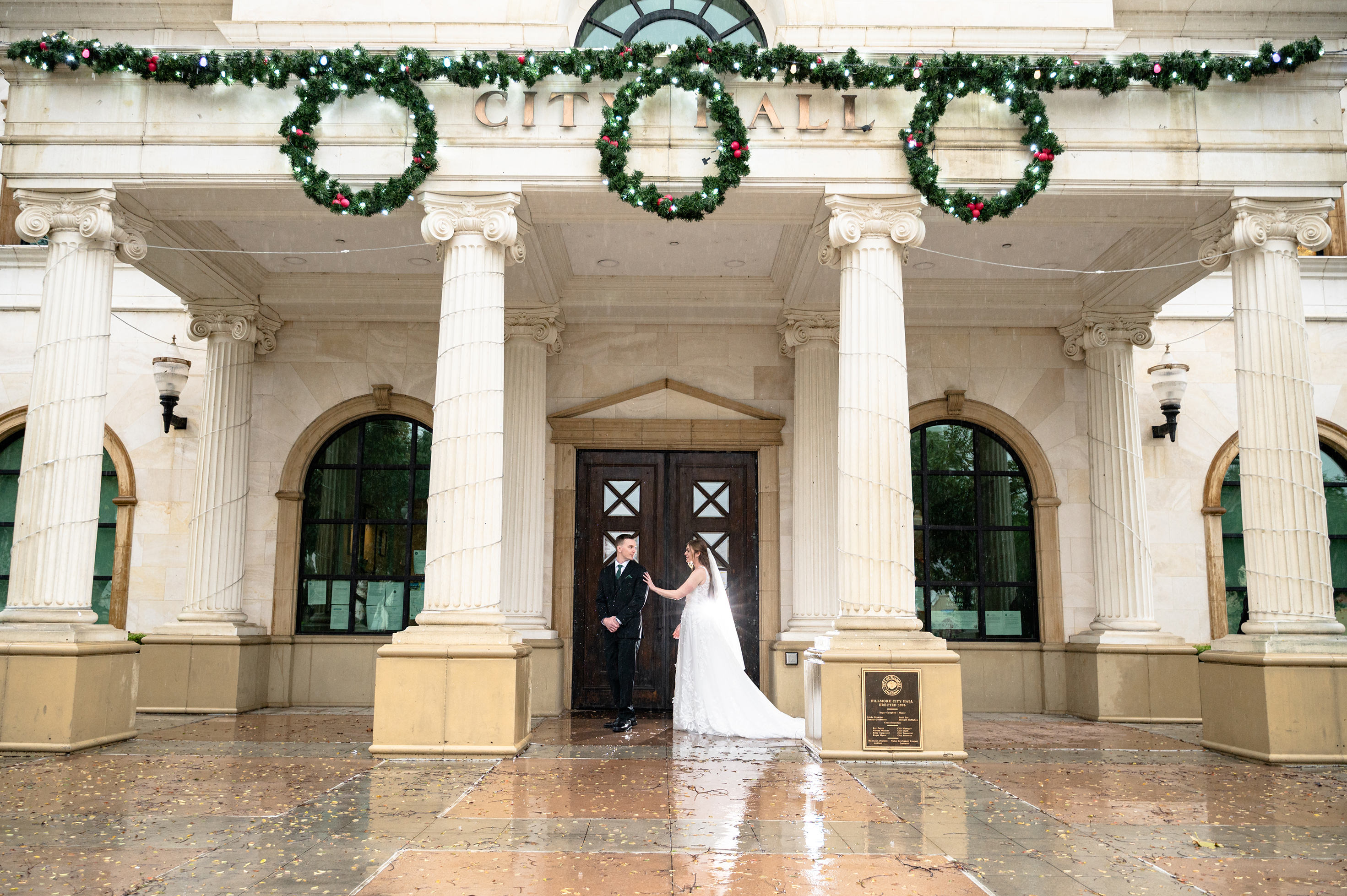 Flat lay wedding details with bouquet, rings, and sparkling bridal heels