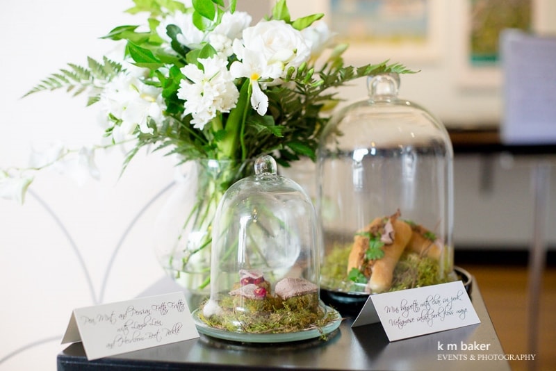 Canapes displayed under glass cloches