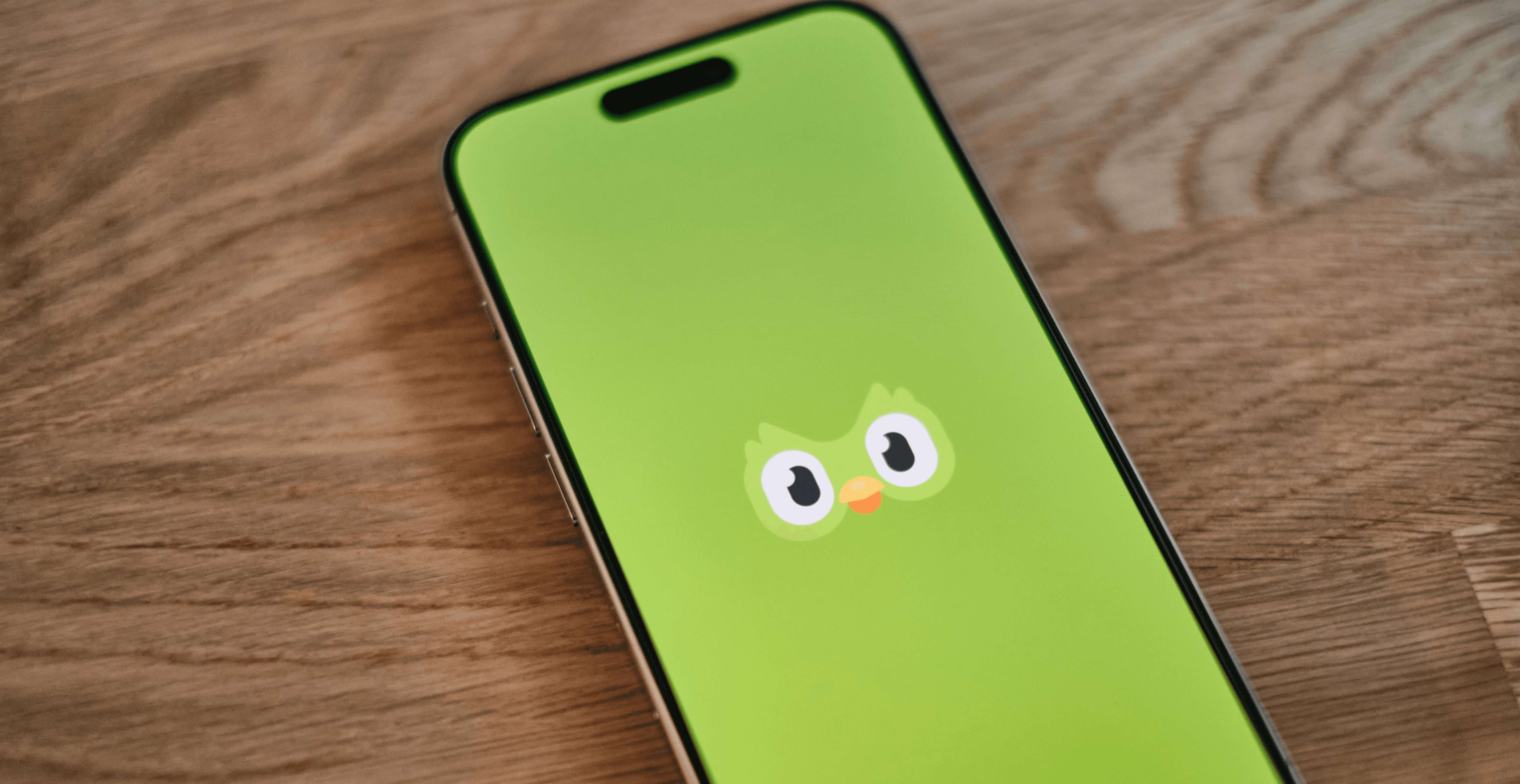 A green phone with a face drawn on it
