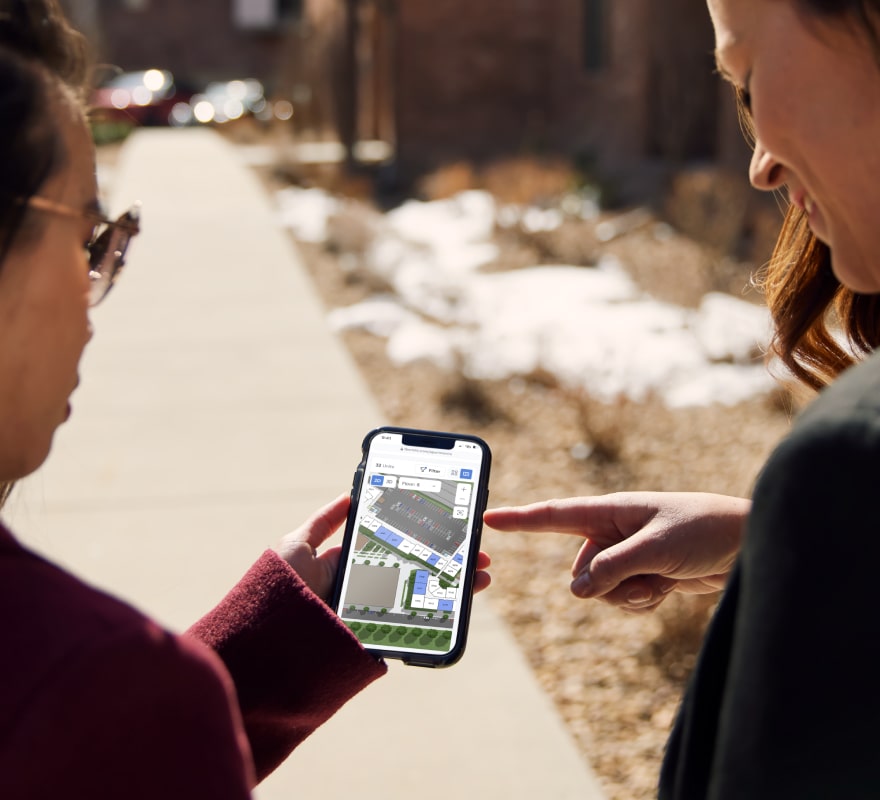 Renter and leasing agent on an apartment tour using Spaces to navigate.