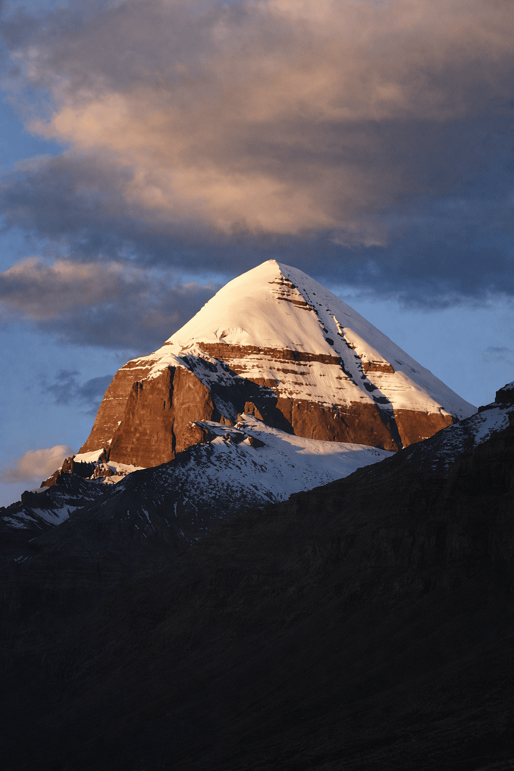 two women in purple and pink kimono standing on street