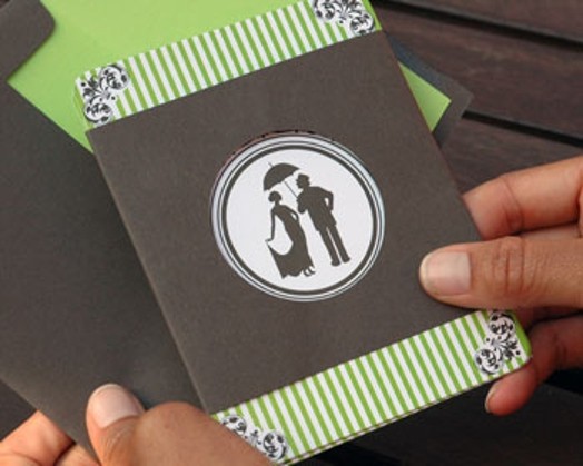 A card invitation designed colored in green stripes and in the middle a circle with a man an a woman figure.