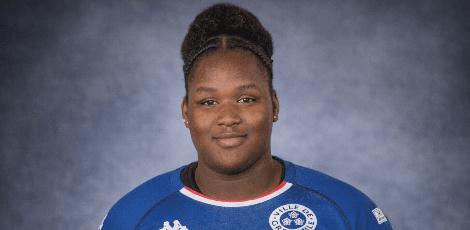 smiling woman wearing white and black pinstriped collared top