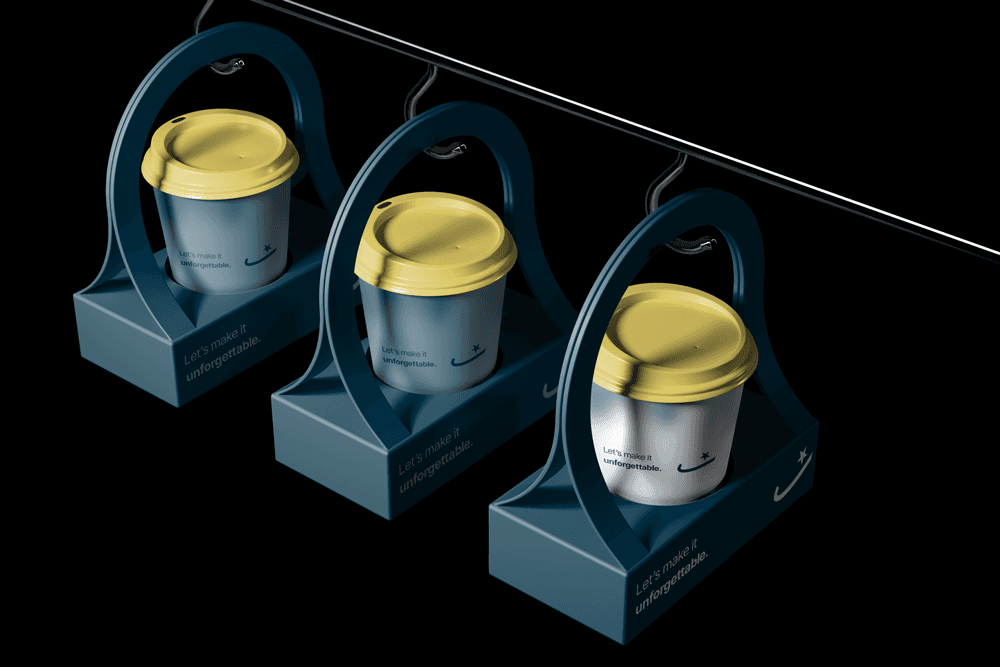 Sama Agency branded coffee cups with golden lids and tagline ‘Let’s make it unforgettable,’ combining creative packaging and marketing identity design.