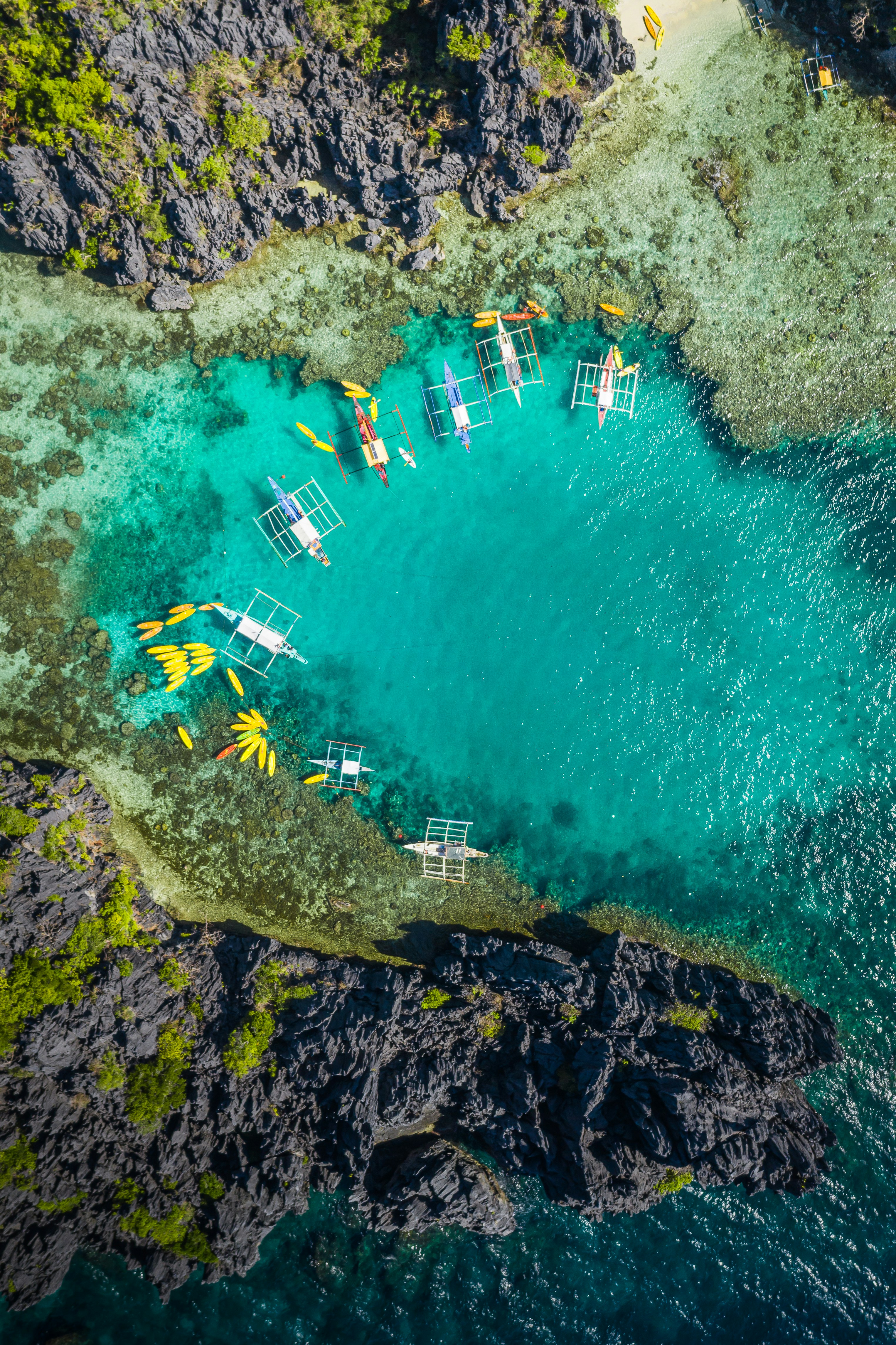 aerial view of white and brown boat on sea during daytime