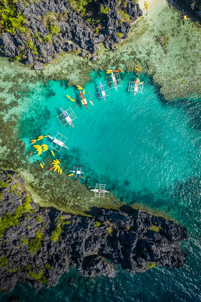 aerial view of white and brown boat on sea during daytime