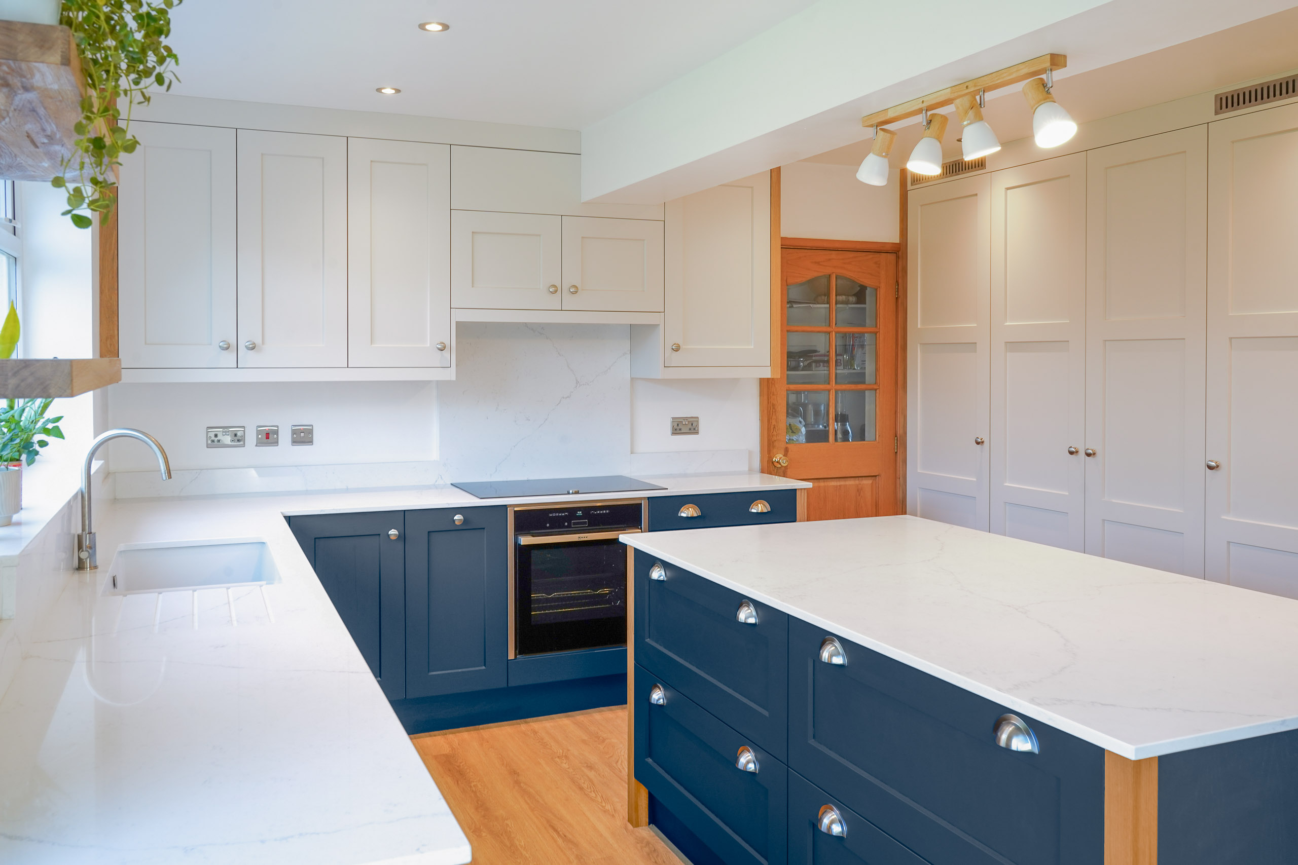 blue shaker kitchen island with curved edges
