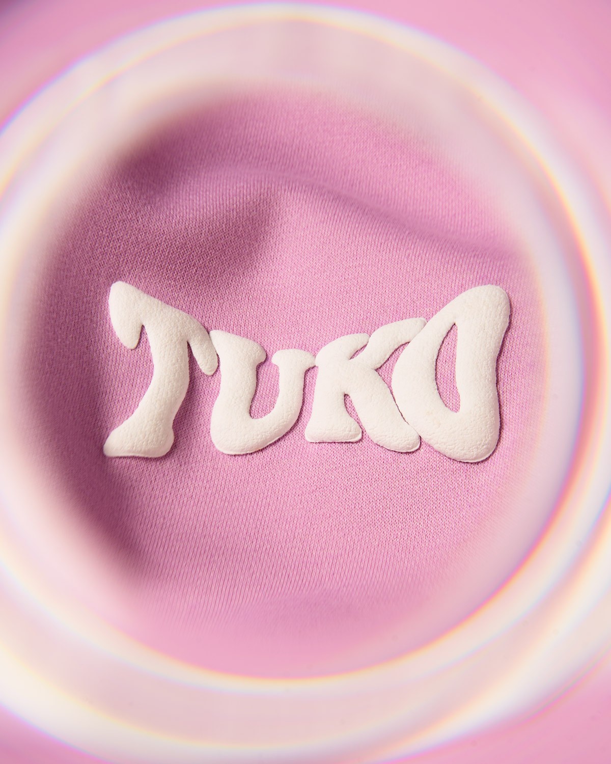 Tuko Clothing pink Dandadan inspired tracksuit detail shot photographer by Matthew Brown (London product photographer).