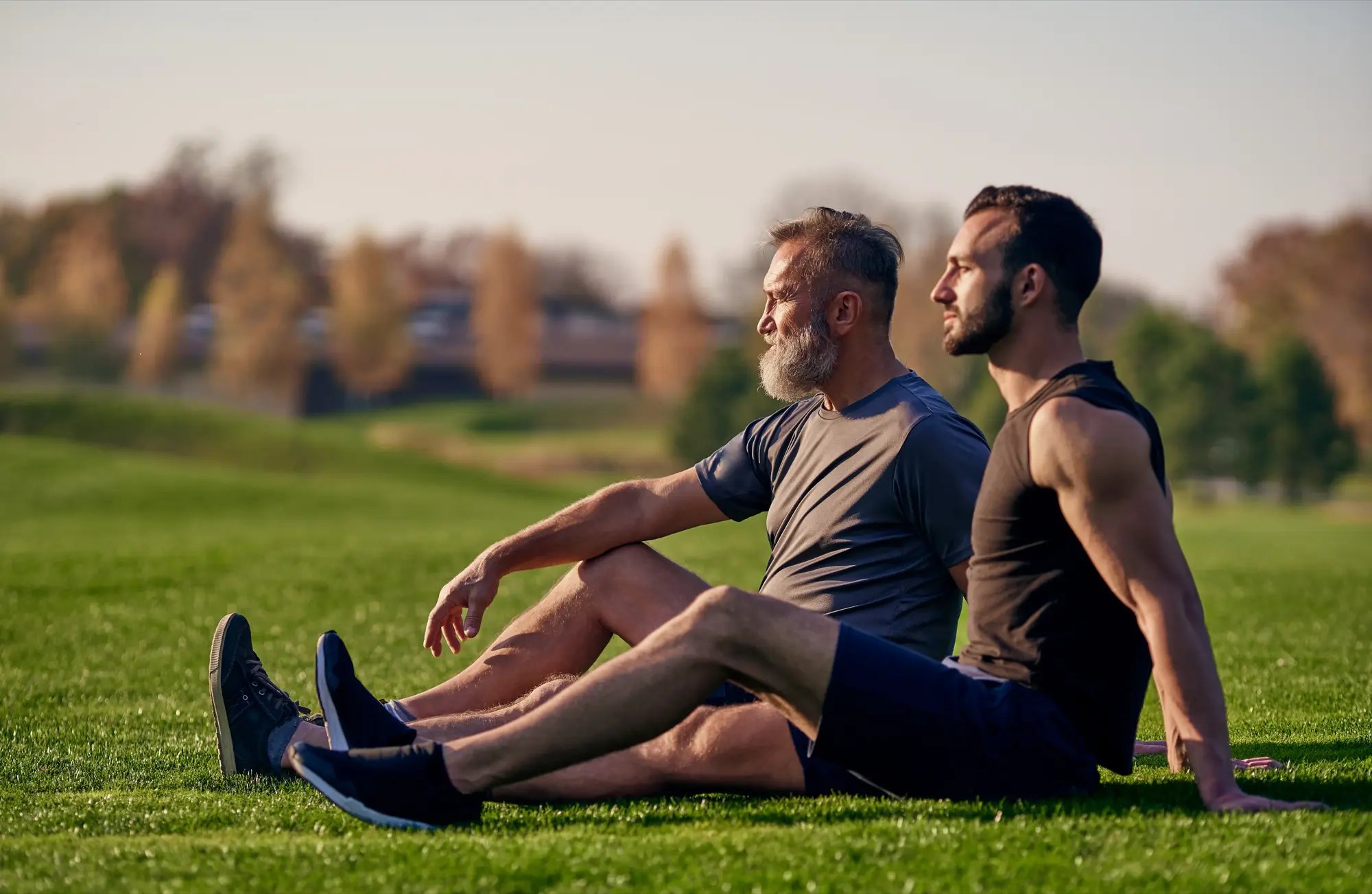 woman wearing gray long-sleeved shirt facing the sea