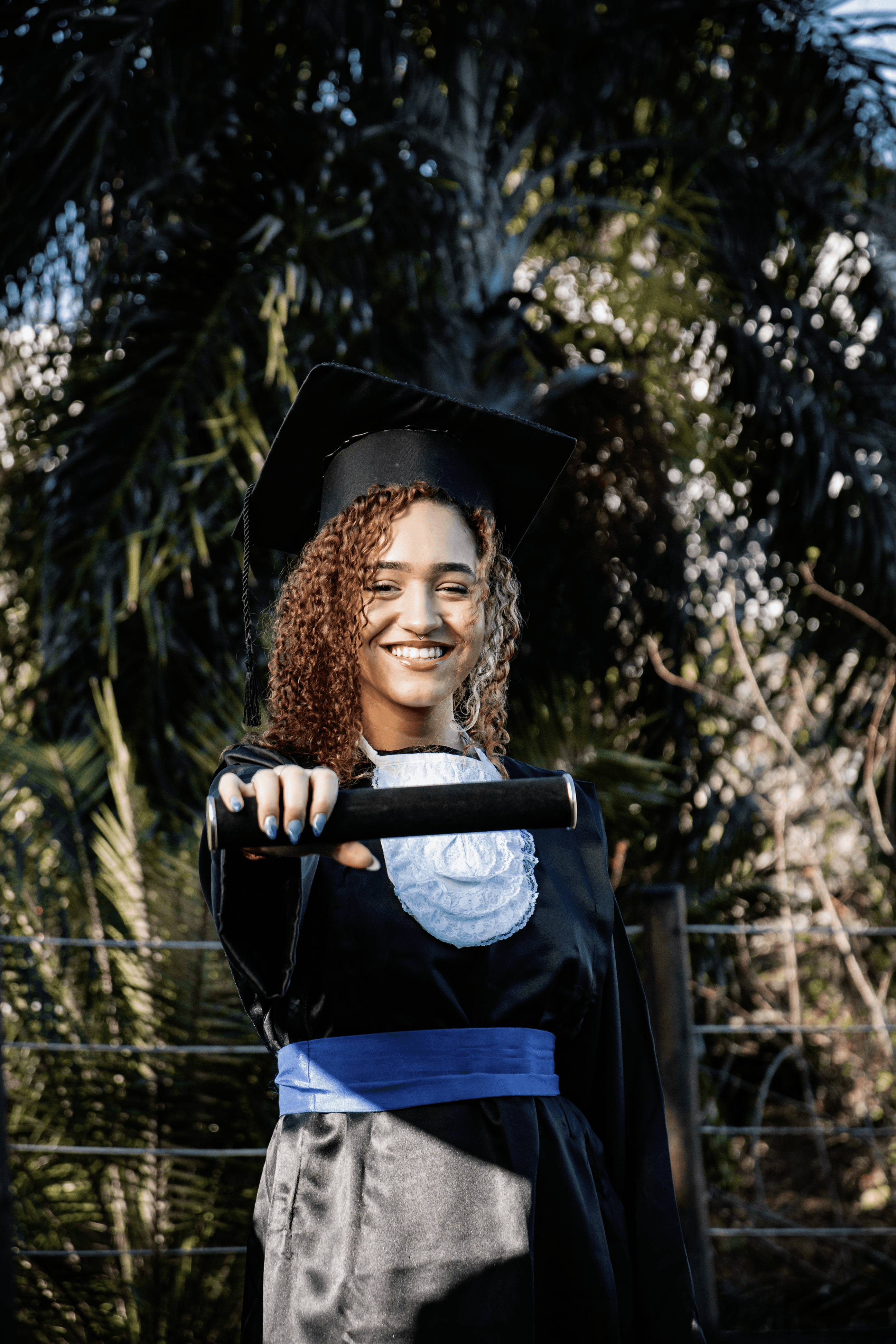 Flat lay of makeup essentials: brush, foundation, and powder on a beige background