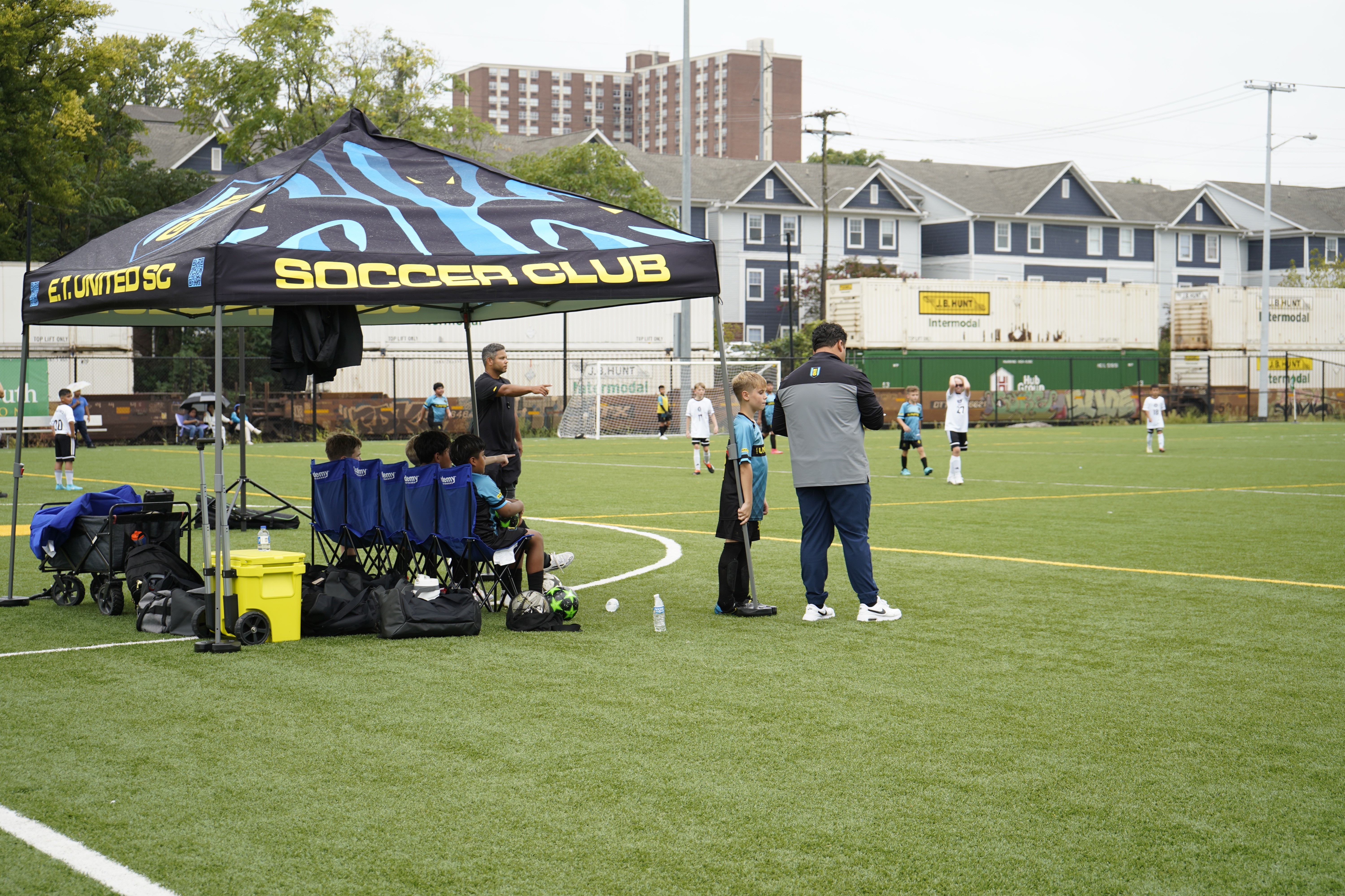Group of men standing with Sufboard