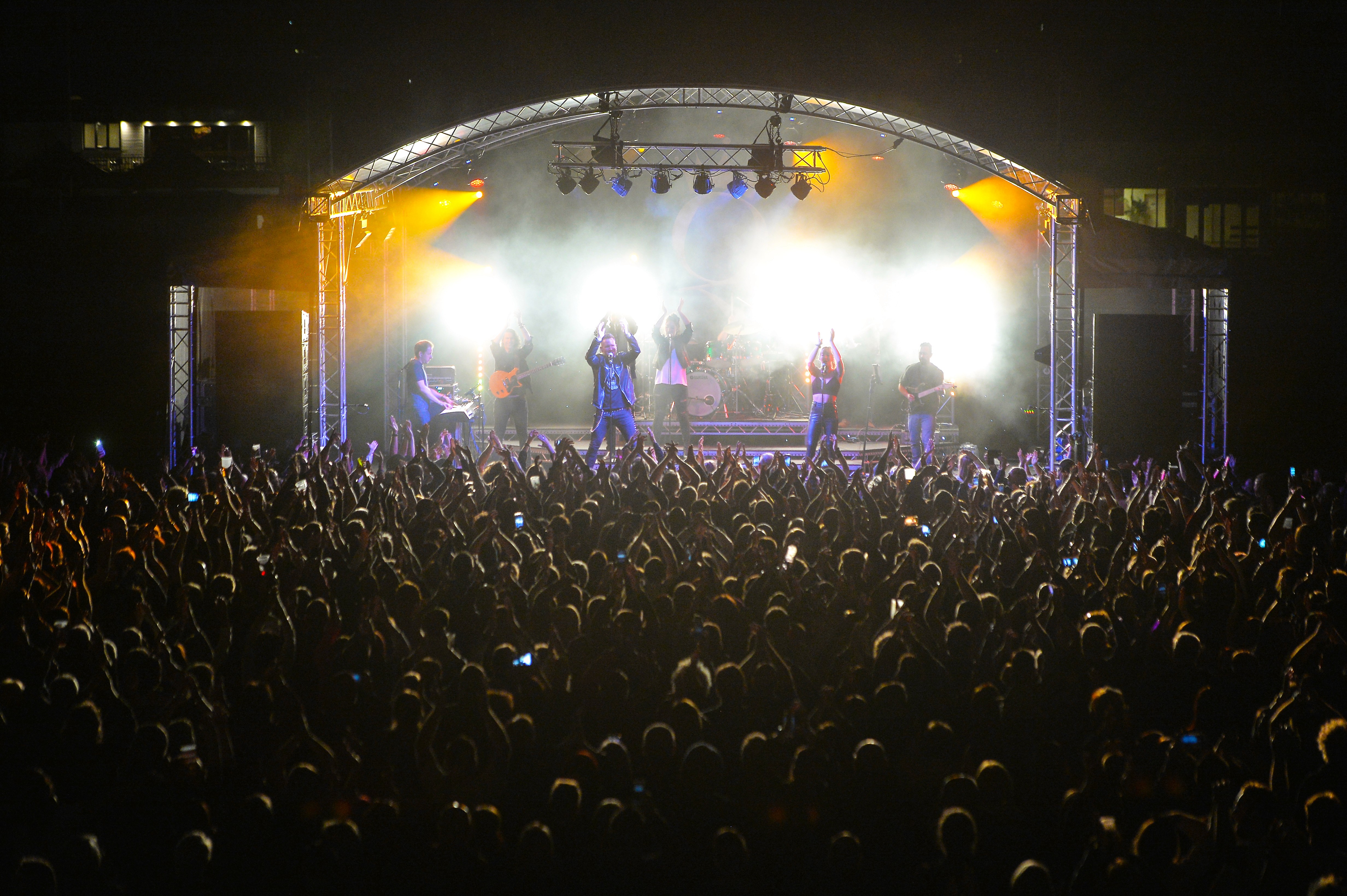 A close up of a person holding the hand of another person