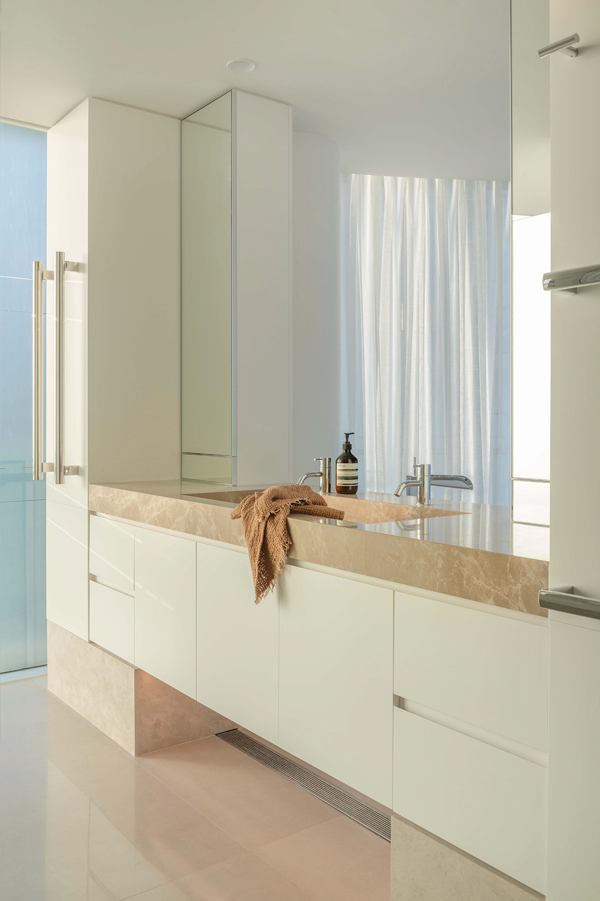 High Tide apartment bathroom with custom vanity, marble benchtop, integrated storage, and soft natural light in Surfers Paradise.