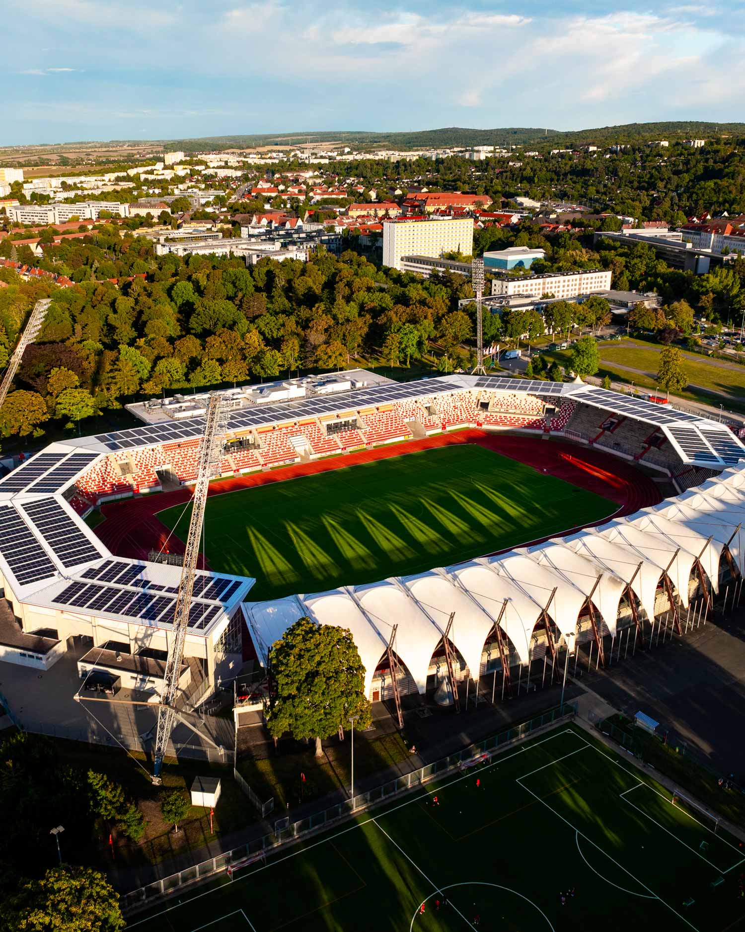 Aerial view of steigerwaldstadion surrounded by trees, captured for imagefilm