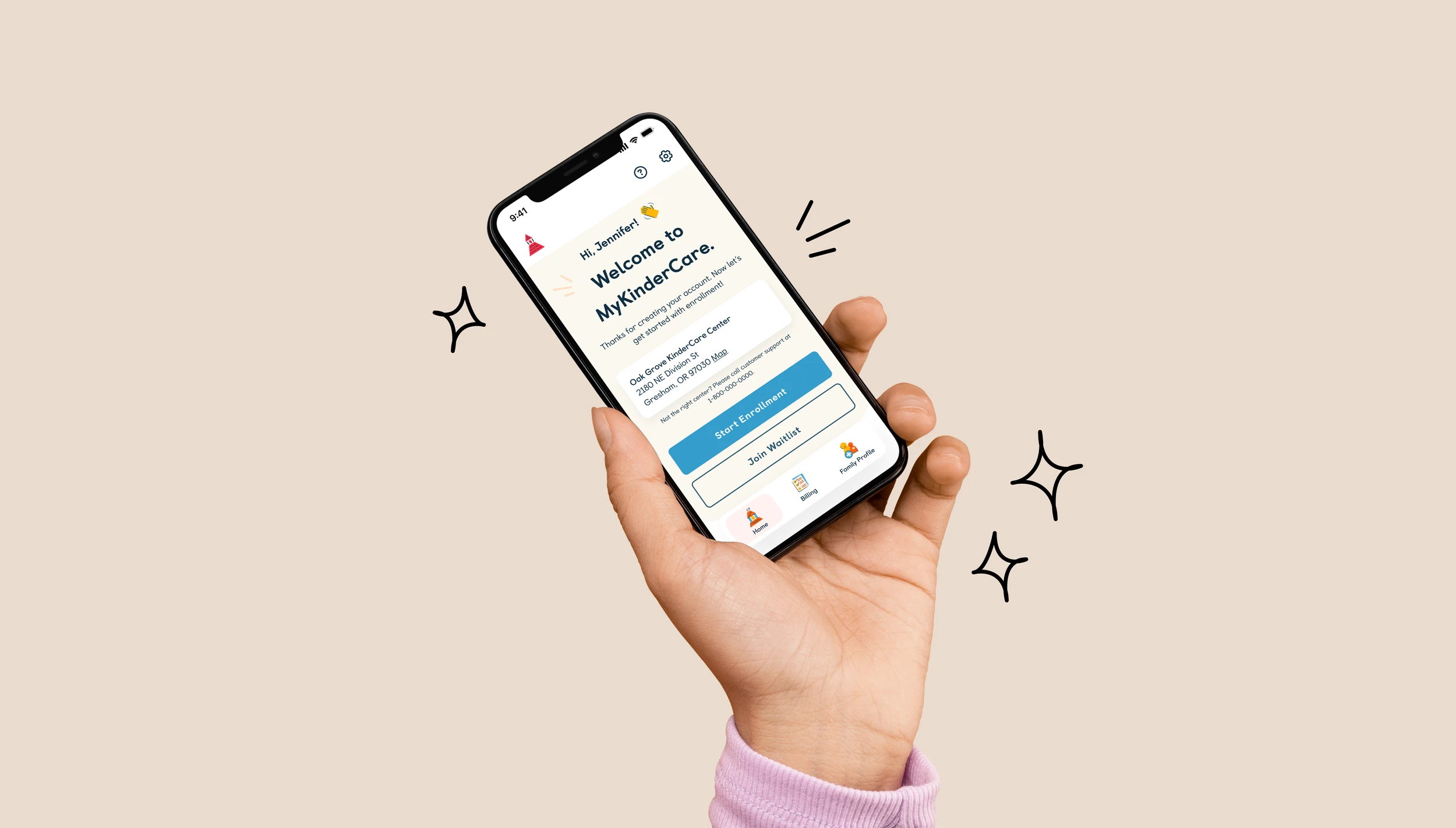 Hand holding smartphone showing KinderCare's parent app with welcome message and childcare center communication features against a warm beige background