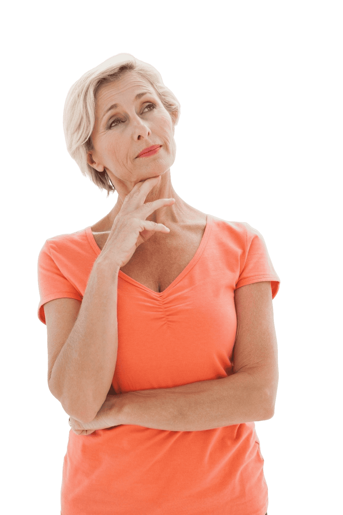 A medical professional smiling and standing in front of the camera