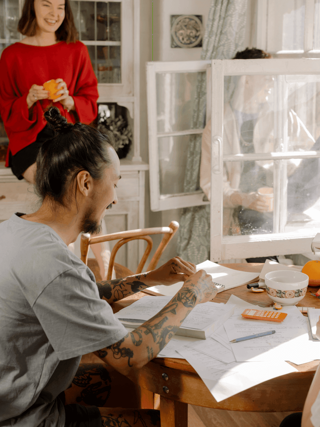 person writing on a piece of paper 