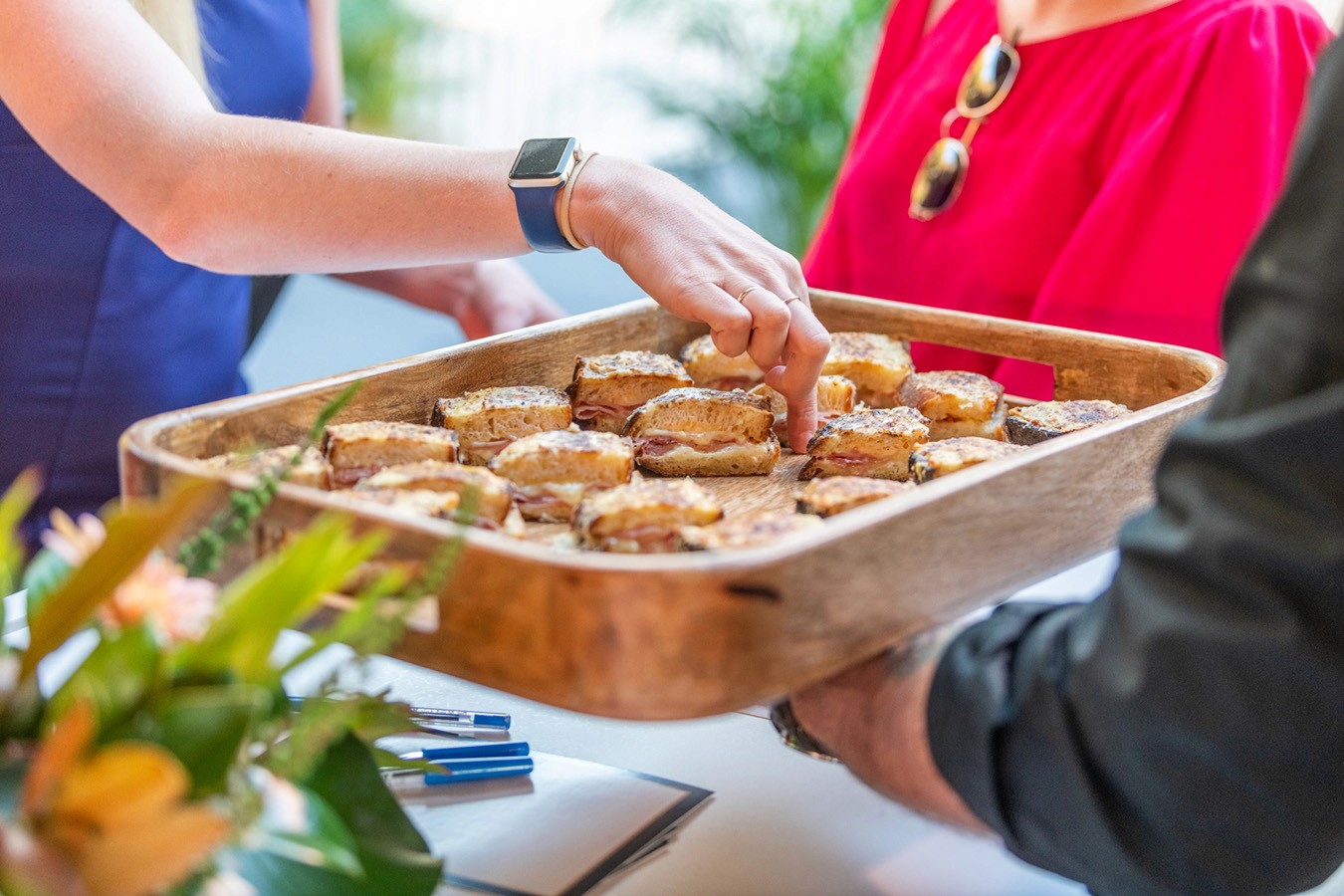 Waiter serving toasted sandwiches at a Morning Tea Function