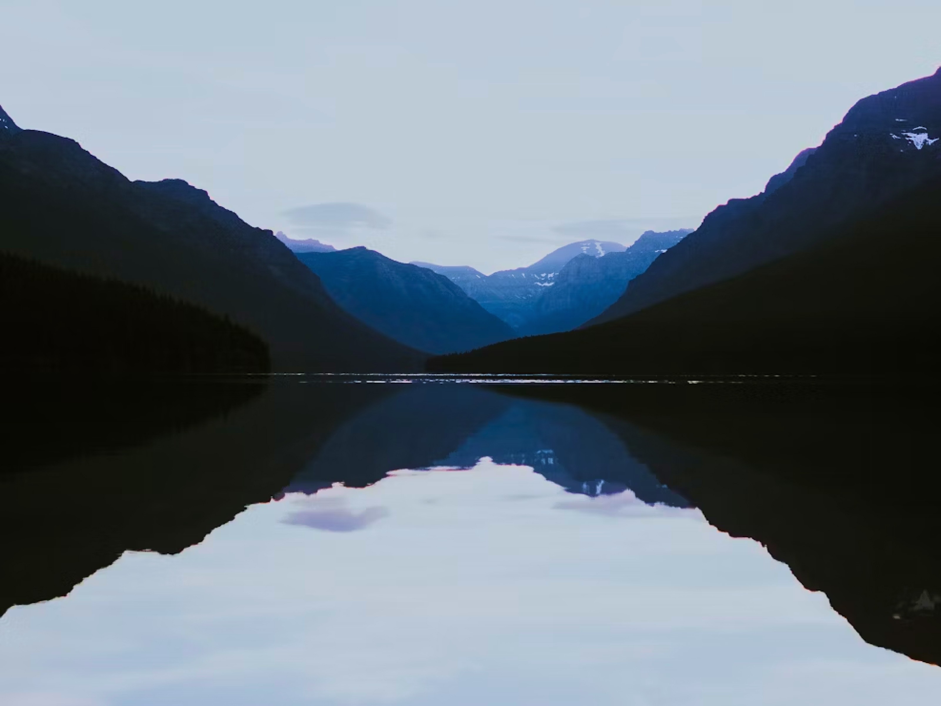An image of a mountain reflecting off a nearby lake