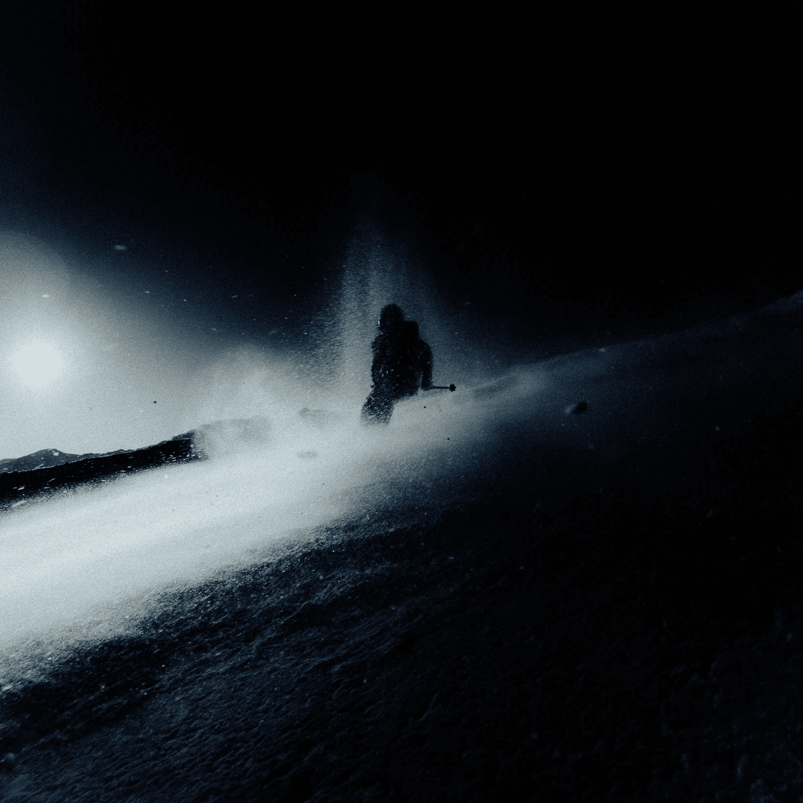 abstract picture of a skier in a snow cloud.