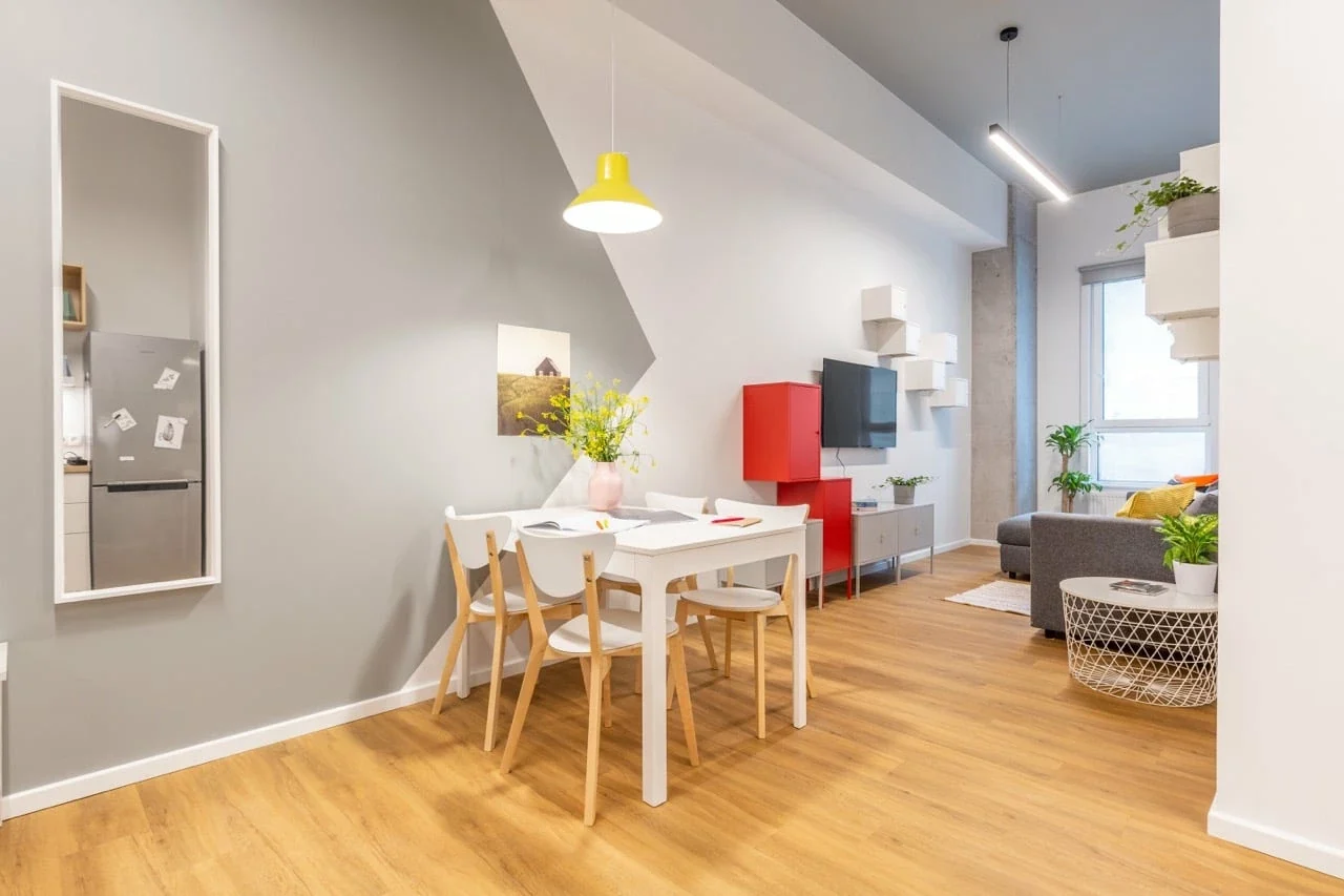 Modern student apartment living and dining area in Kraków