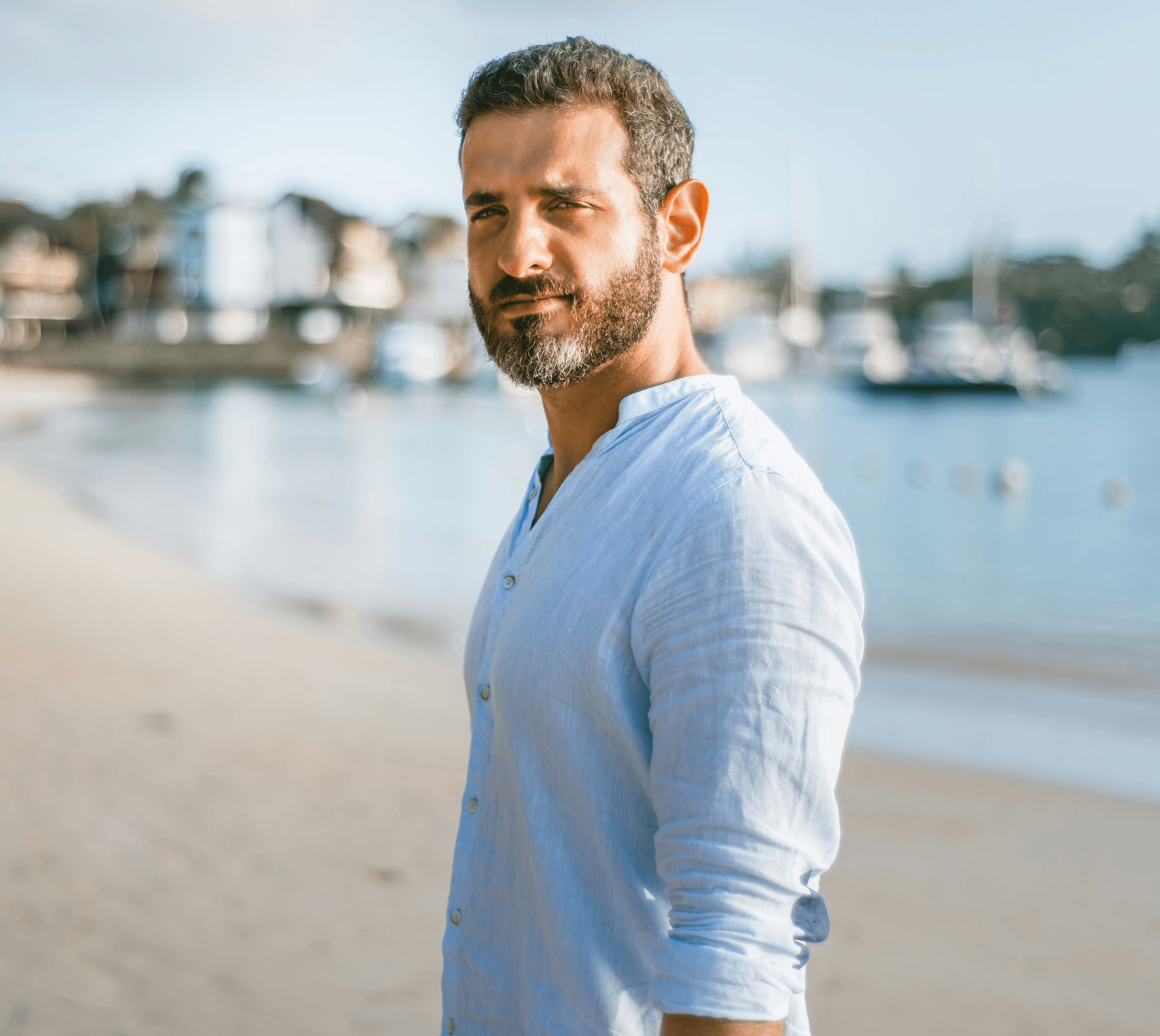 man standing on beach during daytime