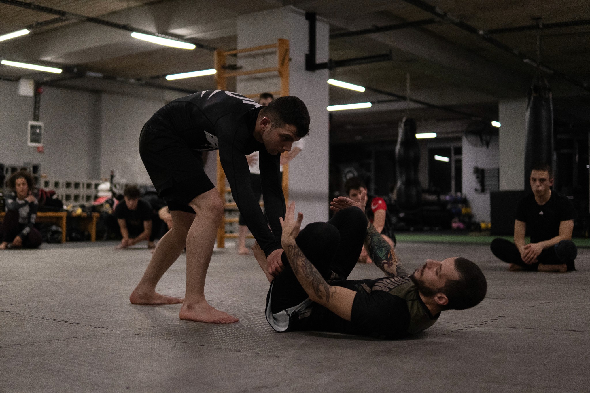 a photo of coach Erkin and his assistant teaching a class