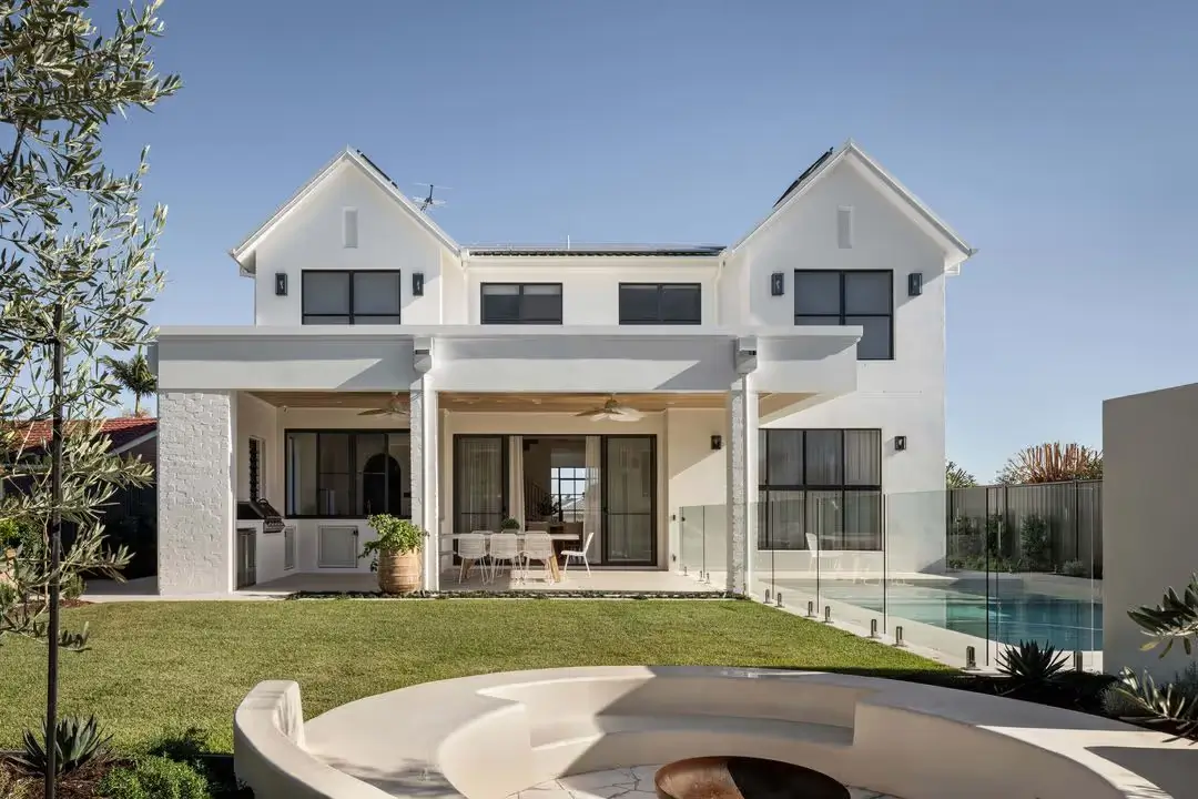 Dunvegan House from the back with a pool, firepit and outdoor entertainment area