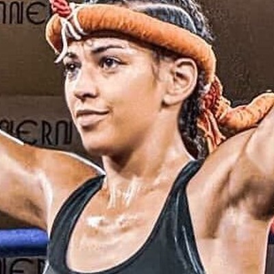 Female Muay Thai fighter training with MFF