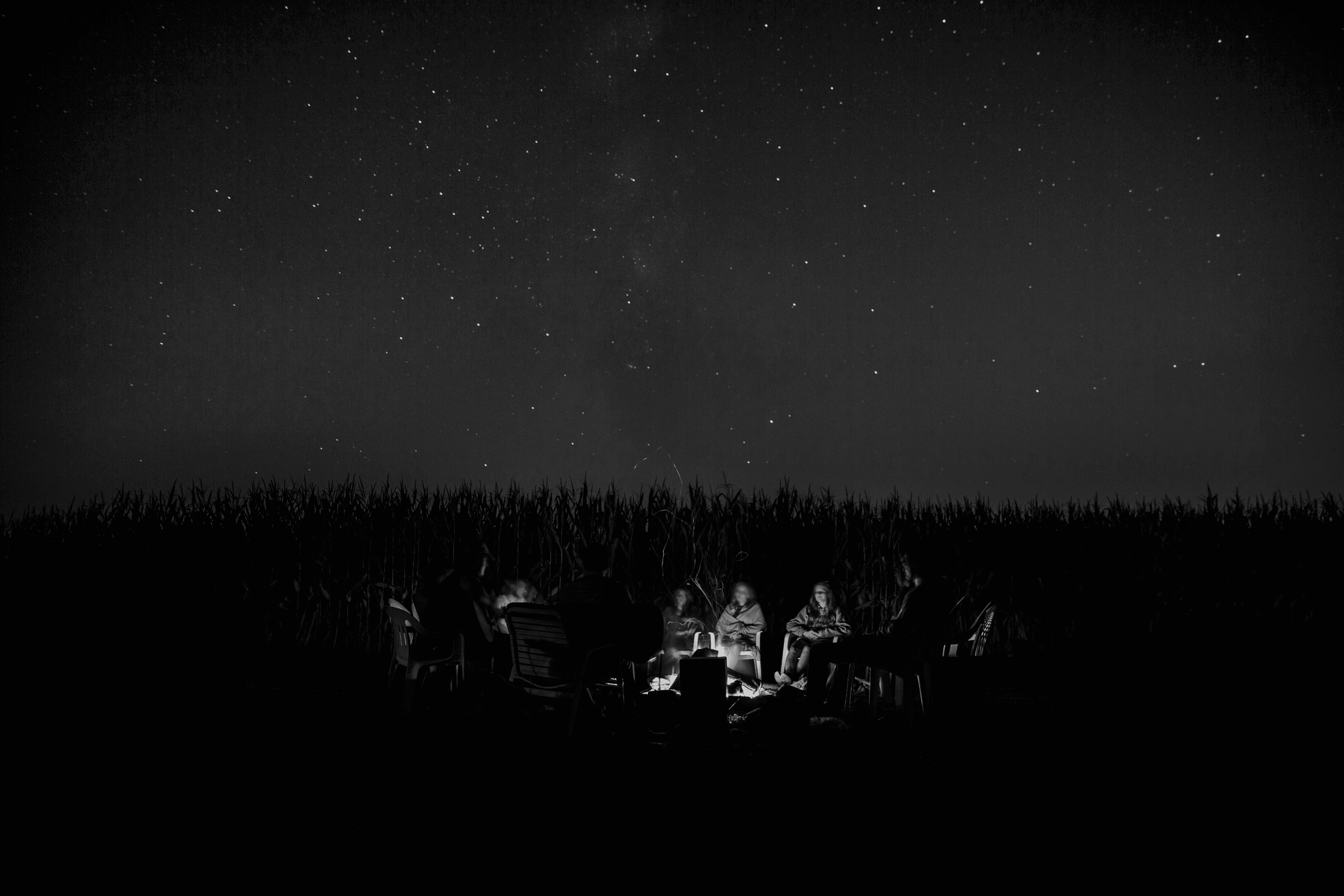people telling stories around the fire