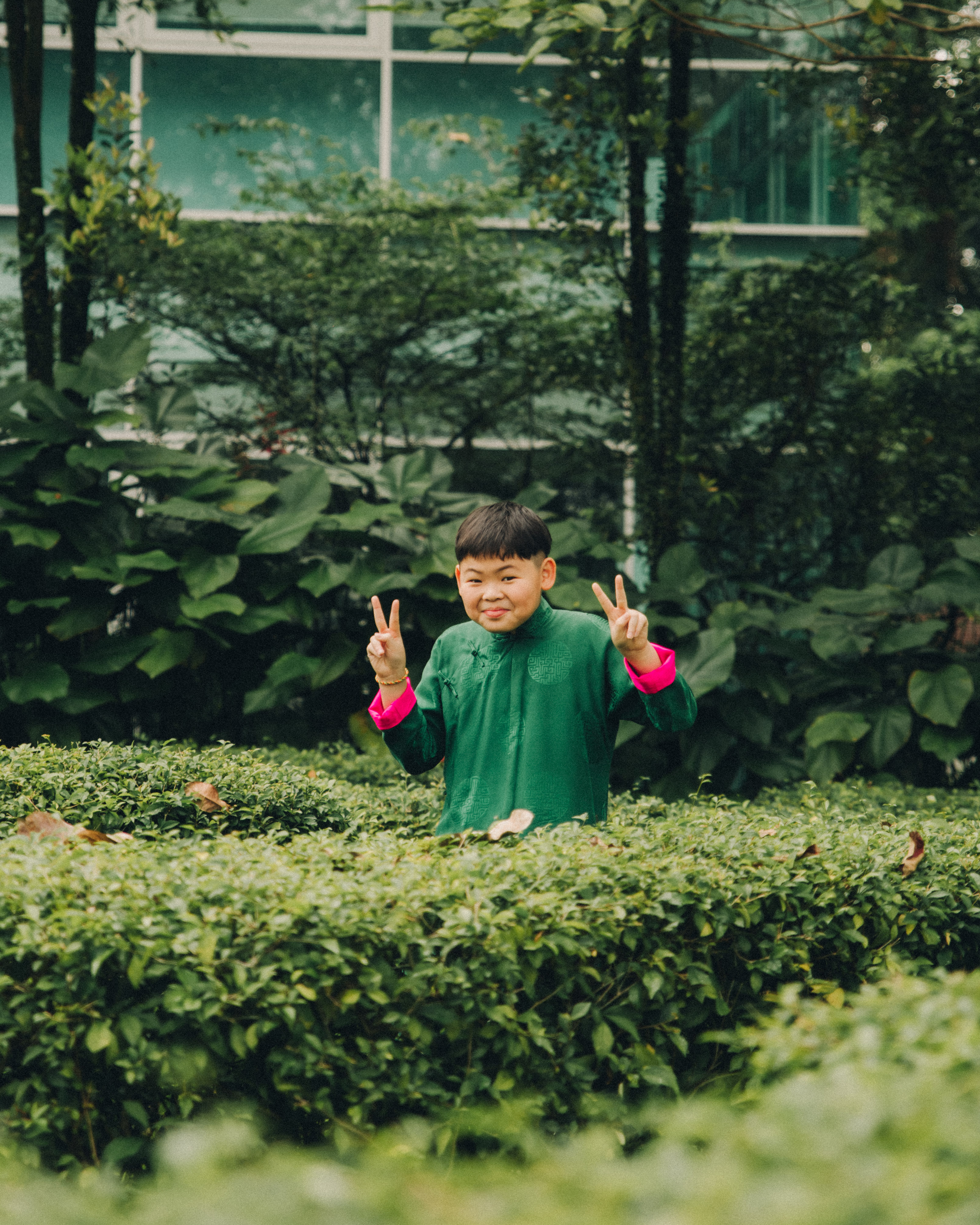 Male portrait: Young man posing confidently in a festive shirt for a CNY solo shoot.
