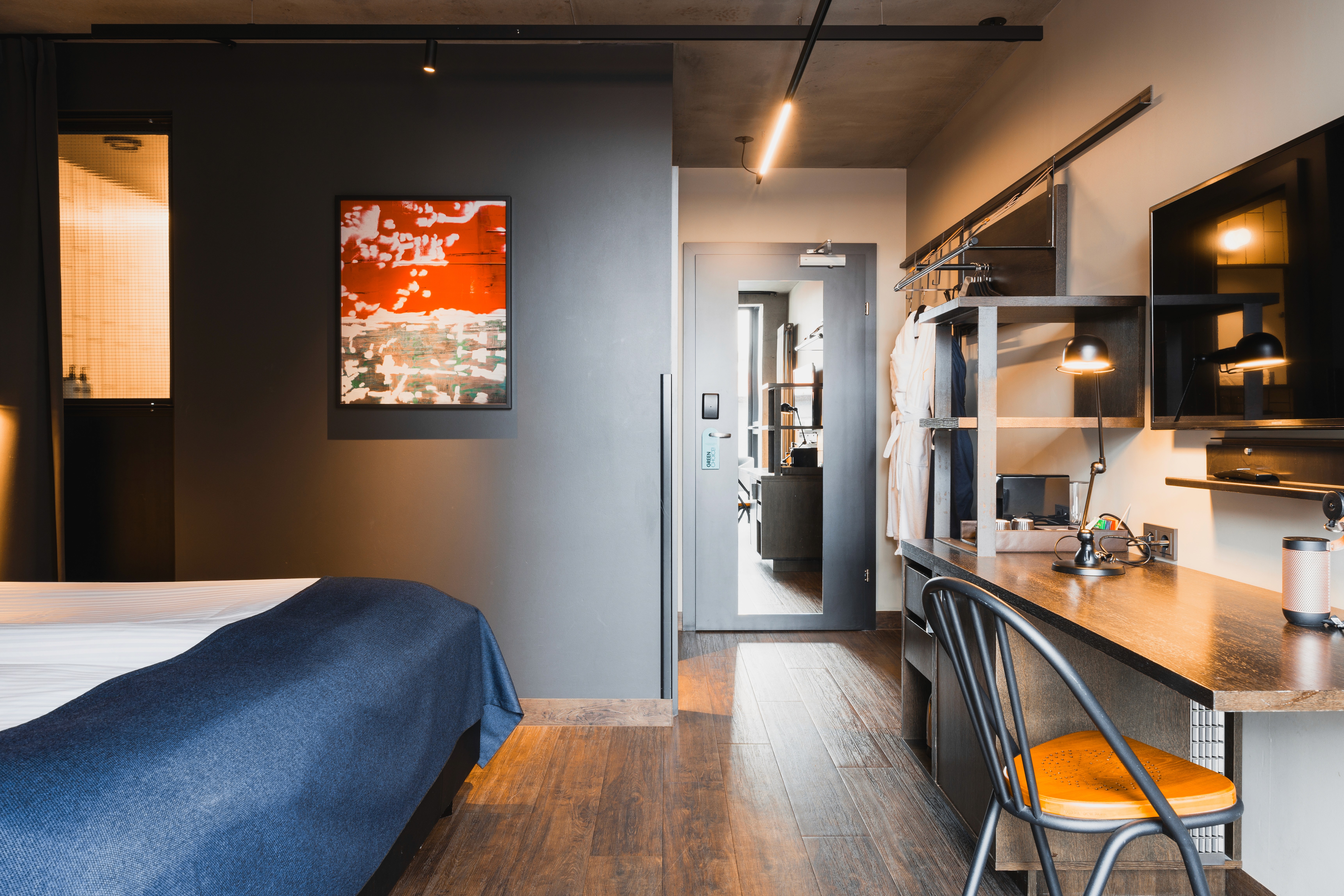 Modern guest room at Exeter Hotel in Reykjavík with a workspace and contemporary design.